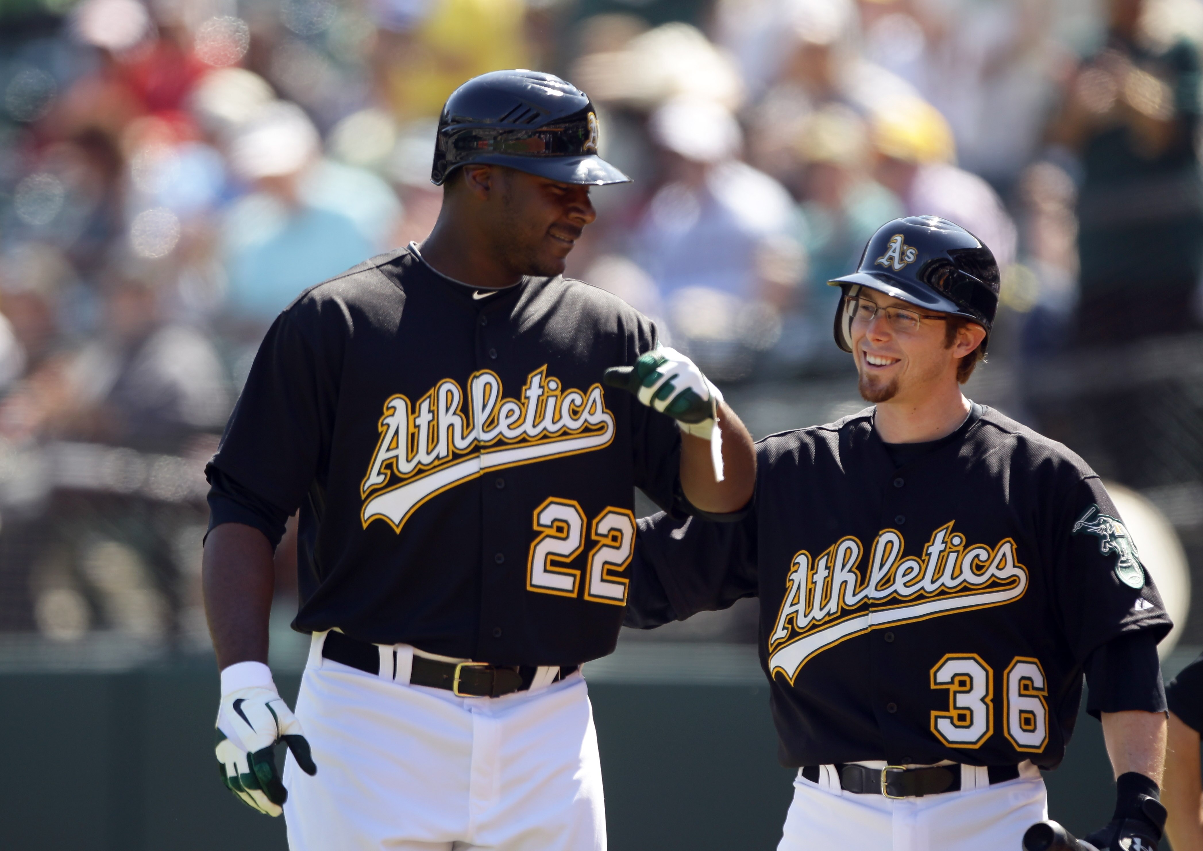 OAKLAND, CA - SEPTEMBER 22:  Chris Carter #22 of the Oakland Athletics is congratulated by Eric Sogard #36 after hitting his first major league home run against the Chicago White Sox at the Oakland-Alameda County Coliseum on September 22, 2010 in Oakland,