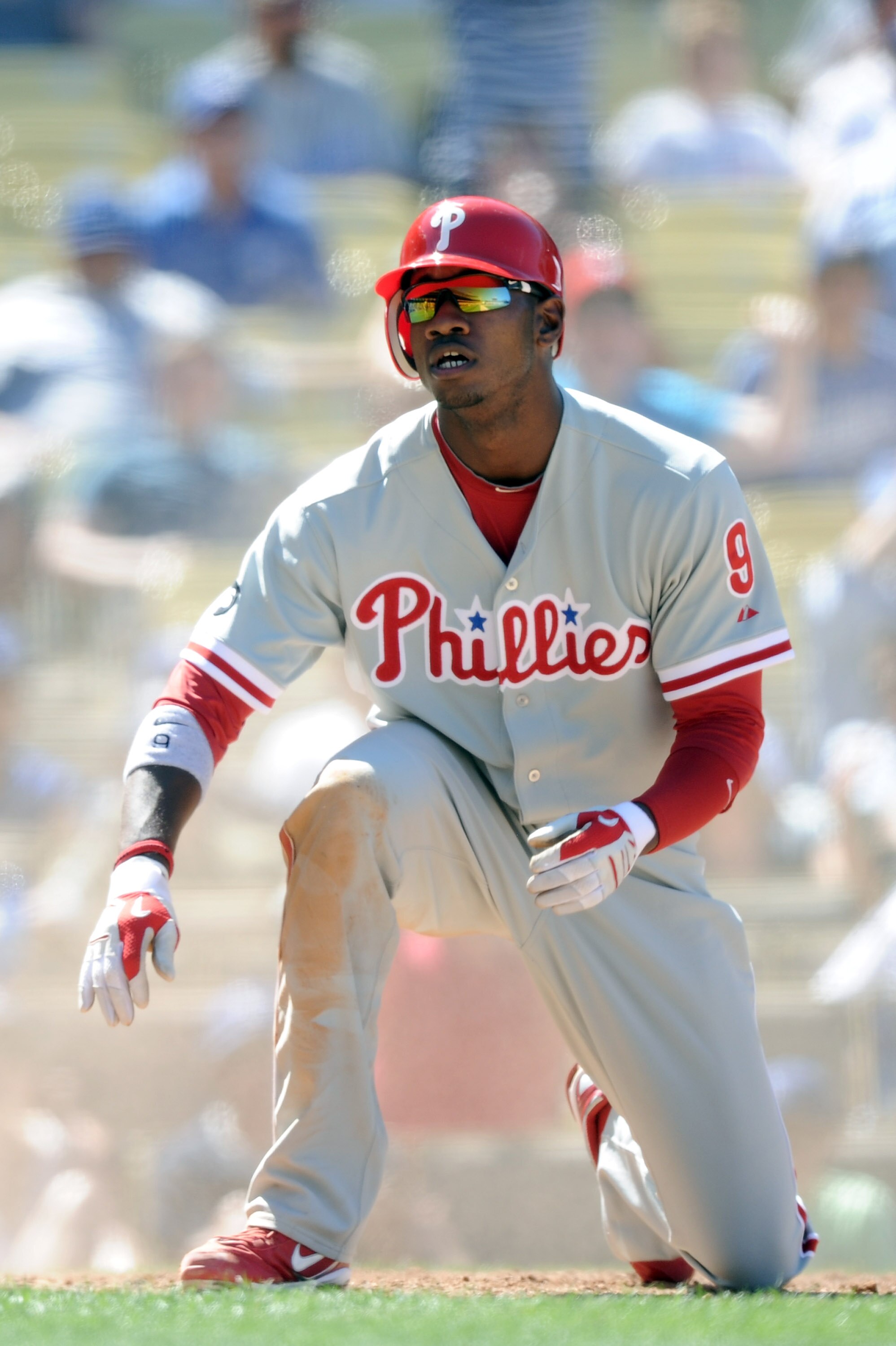 LOS ANGELES, CA - SEPTEMBER 01:  Dominic Brown #9 of the Philadelphia Phillies reacts after his slide to score a run against the Los Angeles Dodgers at Dodger Stadium on September 1, 2010 in Los Angeles, California.  (Photo by Harry How/Getty Images)