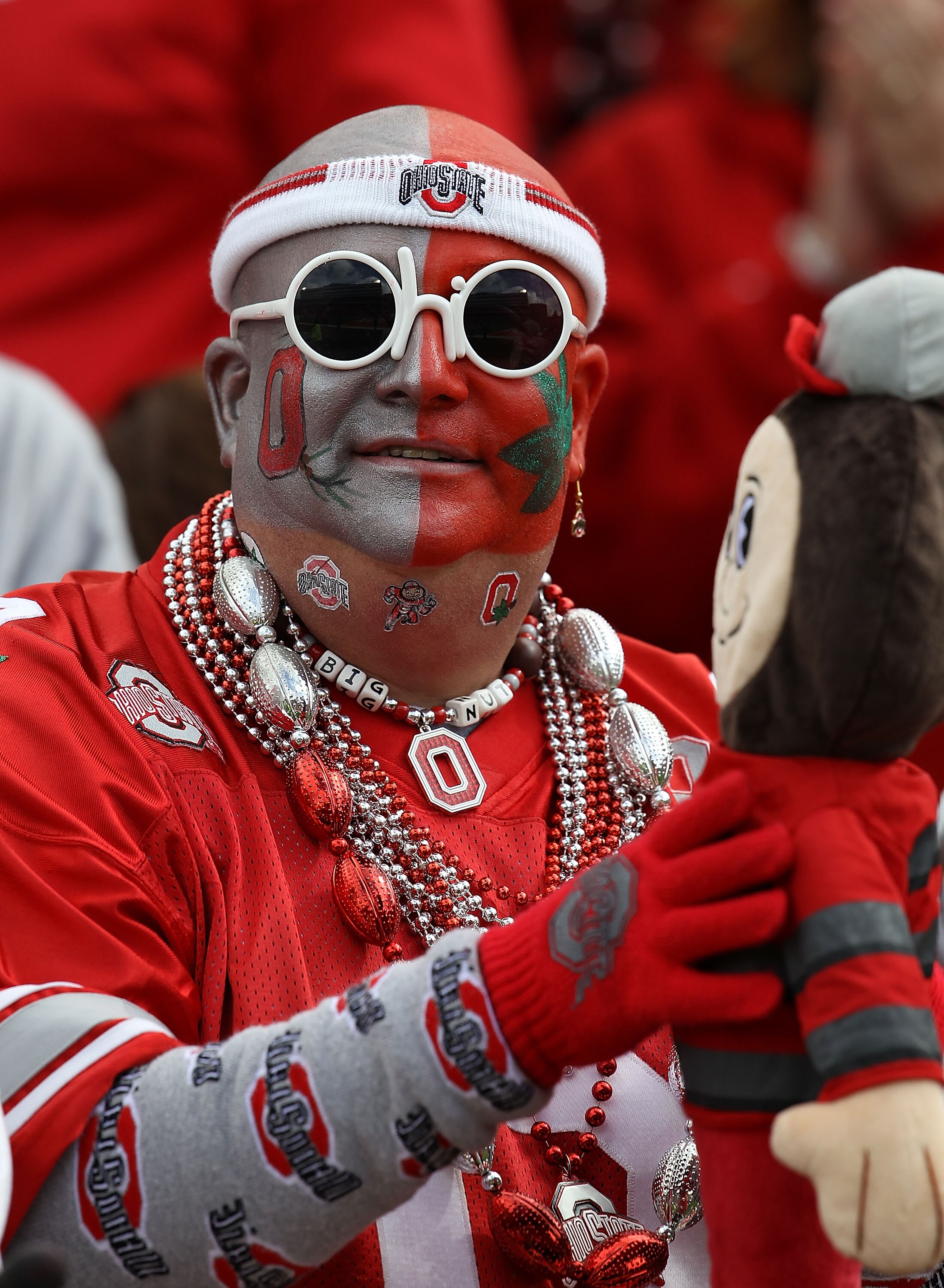 CHAMPAIGN, IL - OCTOBER 02: A fan of the Ohio State Buckeyes watches as his team takes on the Illinois Fighting Illini at Memorial Stadium on October 2, 2010 in Champaign, Illinois. Ohio State defeated Illinois 24-13. (Photo by Jonathan Daniel/Getty Image