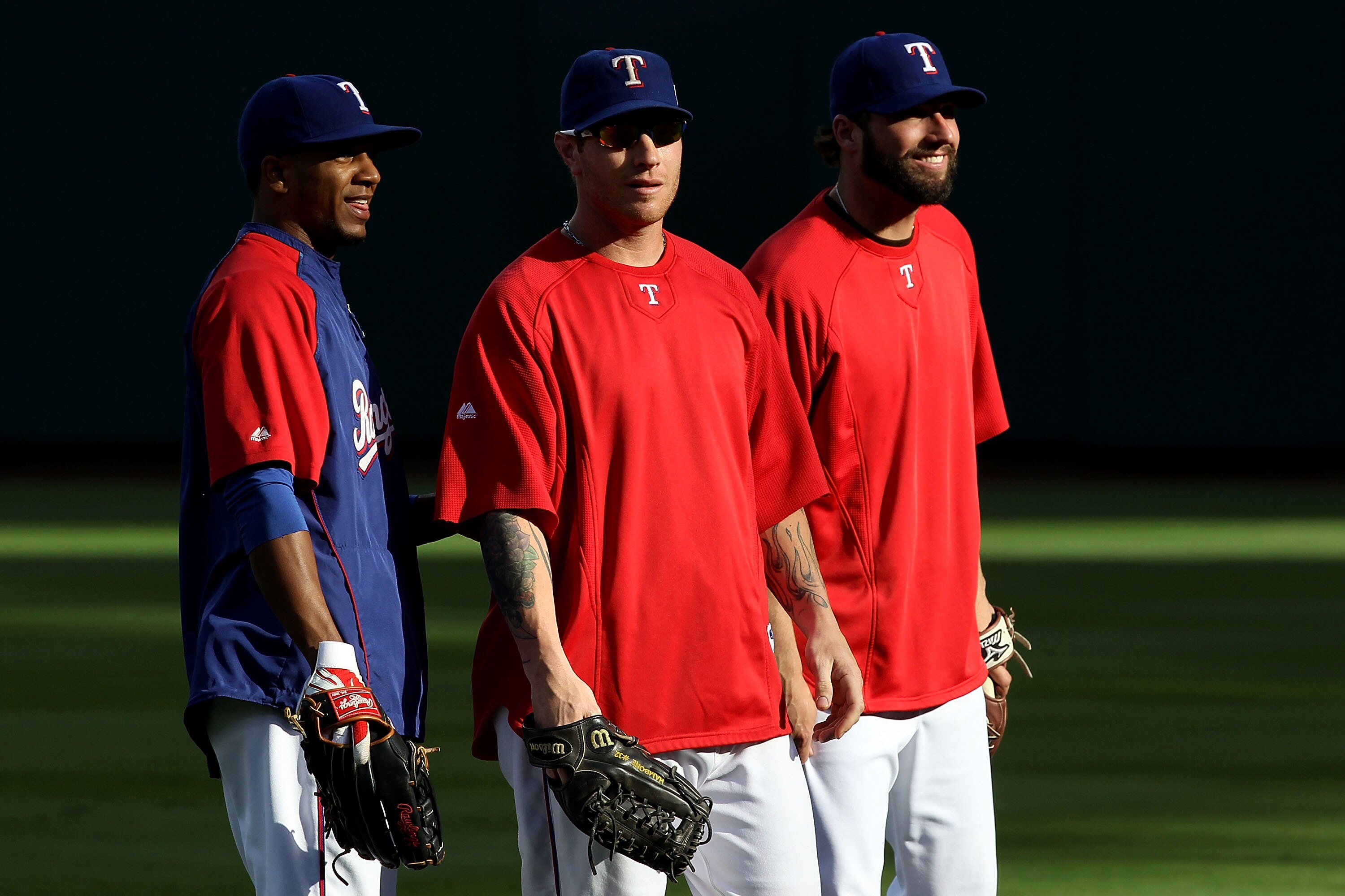 ARLINGTON, TX - OCTOBER 31:  (L-R) Julio Borbon #29, Josh Hamilton #32 and Jeff Francoeur #21 of the Texas Rangers look on during batting practice against the San Francisco Giants in Game Four of the 2010 MLB World Series at Rangers Ballpark in Arlington