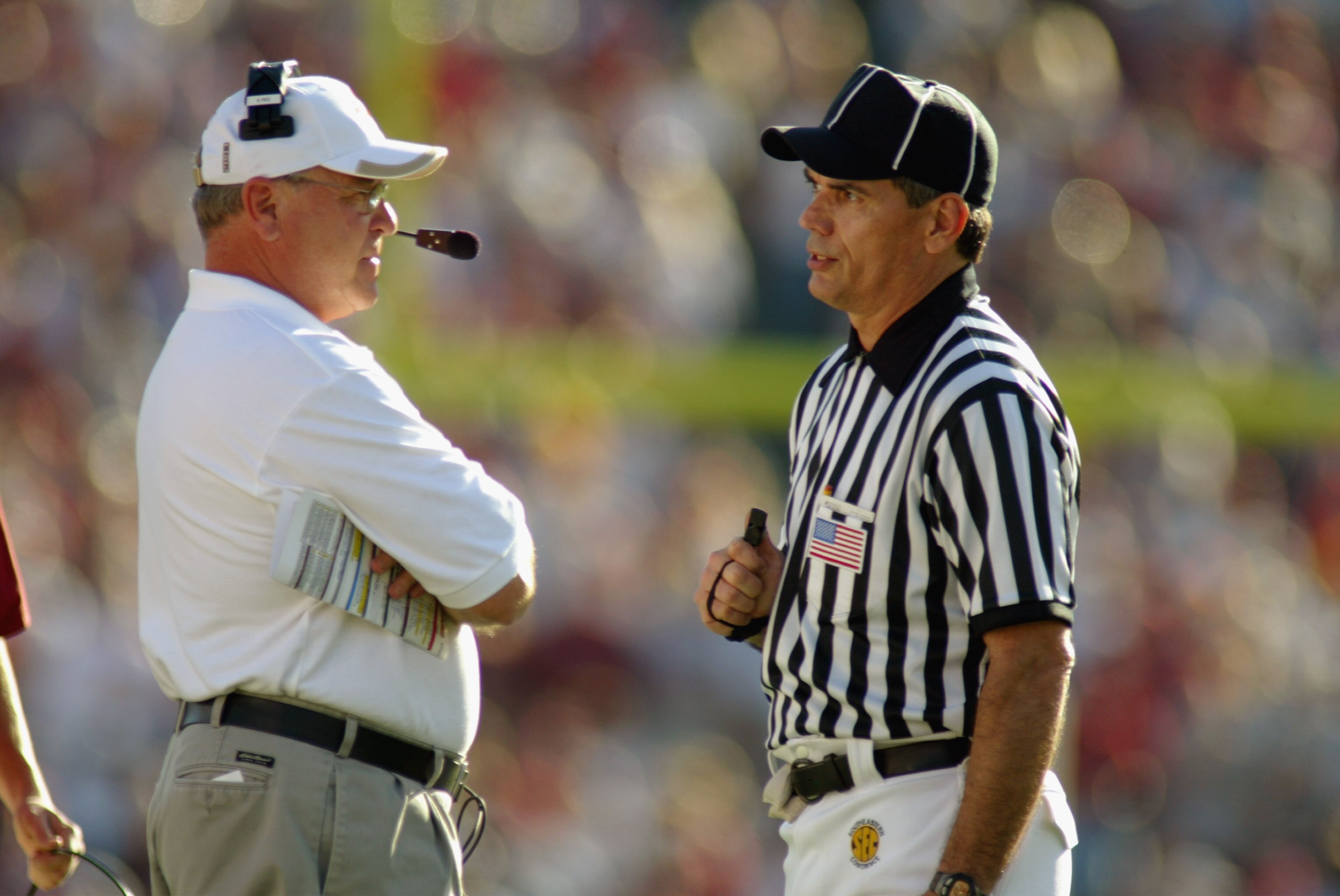PASADENA, CA - JANUARY 1:  Head coach Mike Price of the Washington State University Cougars talks to an official during the 89th Rose Bowl against the University of Oklahoma Sooners on January 1, 2003  at the Rose Bowl in Pasadena, California.  Price move