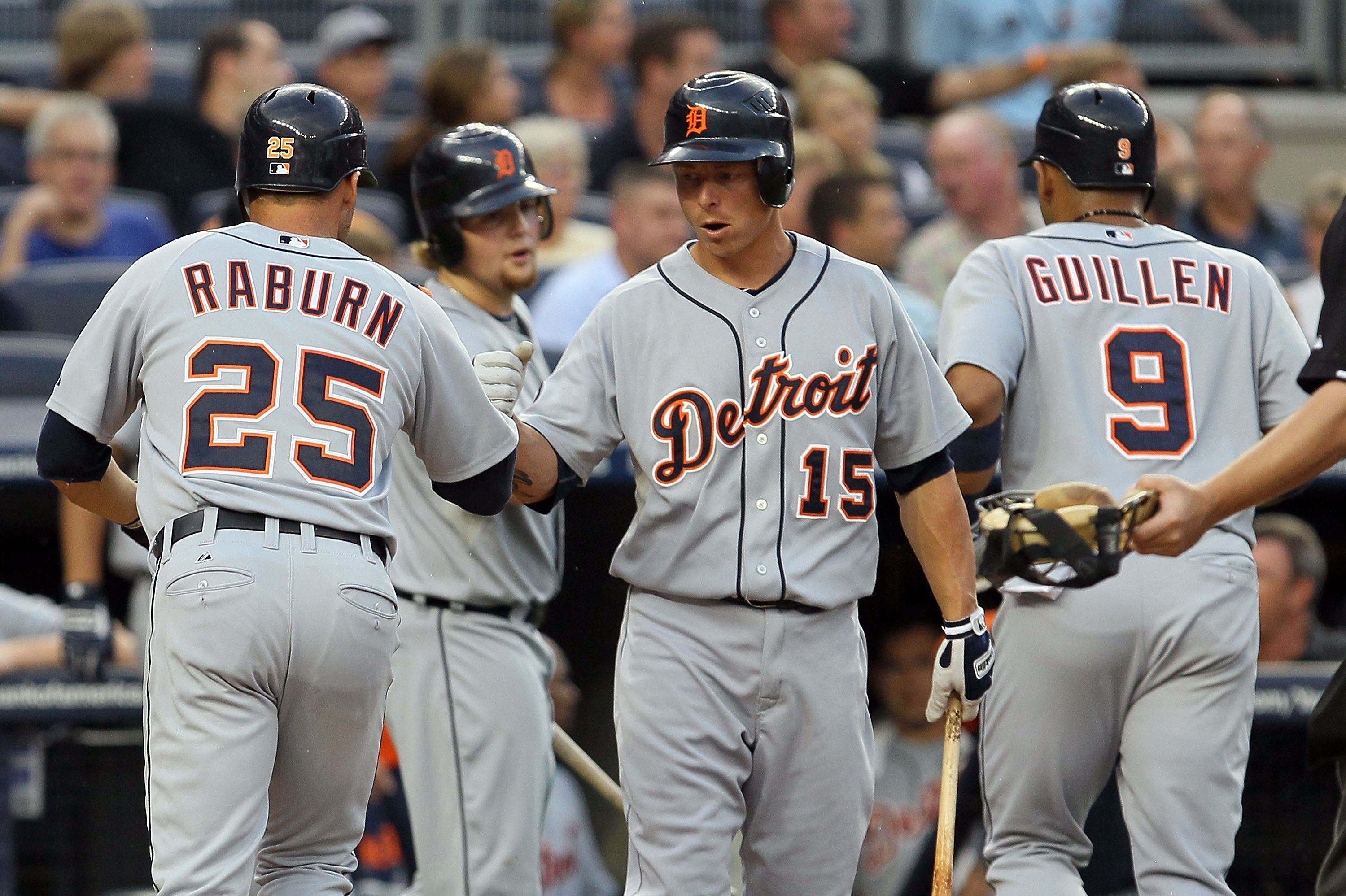 NEW YORK - AUGUST 16:  Ryan Raburn #25 of the Detroit Tigers celebrates his second inning two run home run against the New York Yankees with teammate Brandon Inge #15 on August 16, 2010 at Yankee Stadium in the Bronx borough of New York City.  (Photo by J