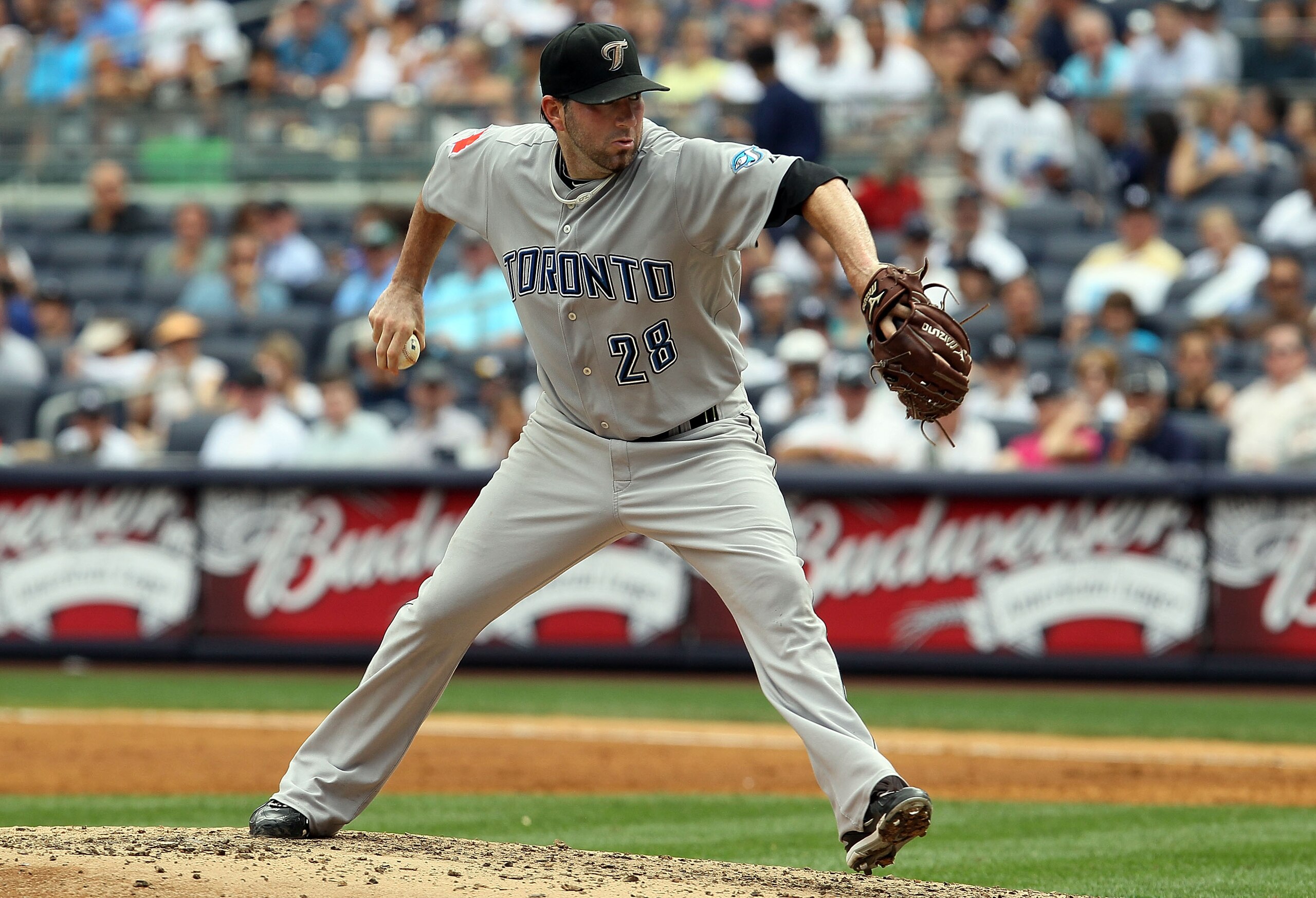 NEW YORK - AUGUST 04:  Shaun Marcum #28 of the Toronto Blue Jays delivers a pitch against the New York Yankees on August 4, 2010 at Yankee Stadium in the Bronx borough of New York City.  (Photo by Jim McIsaac/Getty Images)
