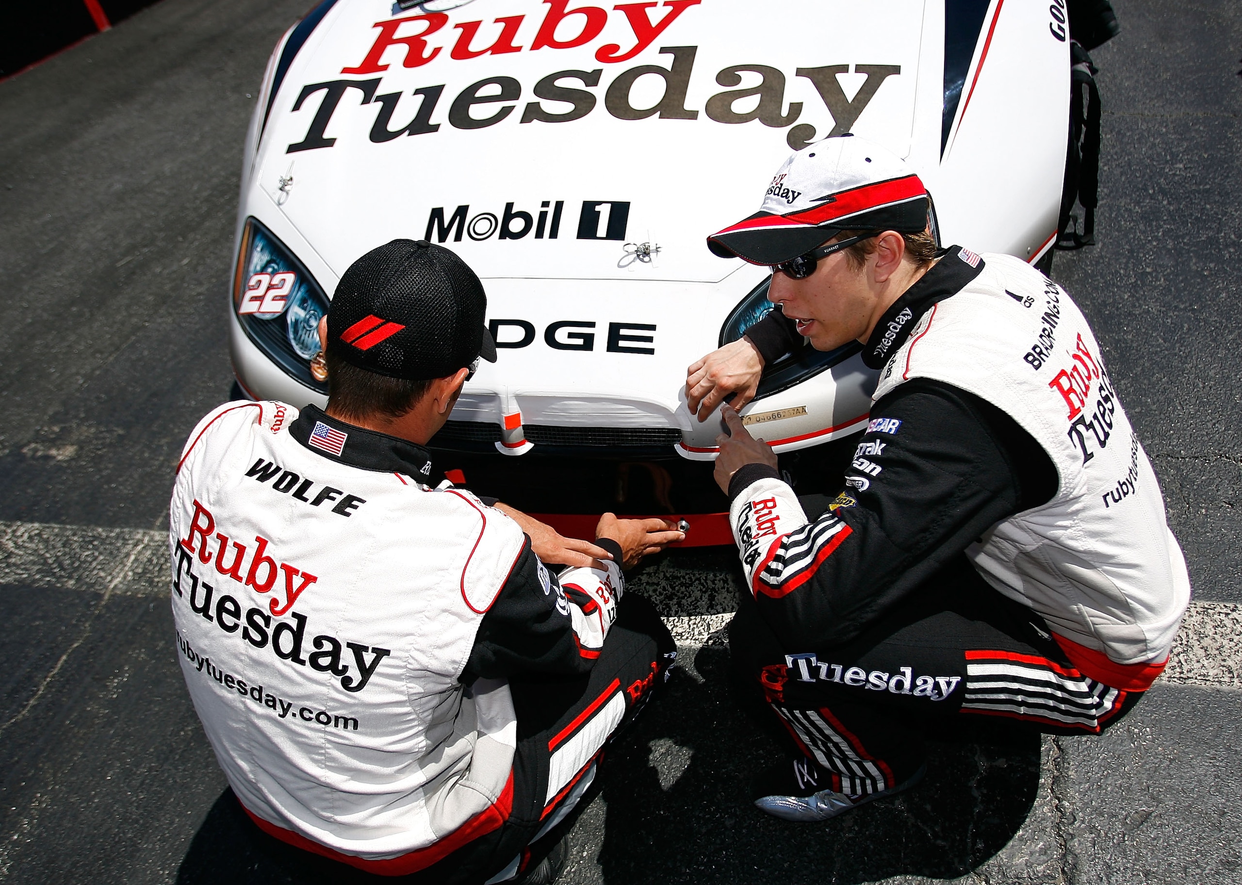 DOVER, DE - MAY 15: Brad Keselowski (R), driver of the #22 Ruby Tuesday Dodge, talks with his crew chief Paul Wolfe on the grid prior to the start of NASCAR Nationwide Series Heluva Good! 200 at Dover International Speedway on May 15, 2010 in Dover, Delaw