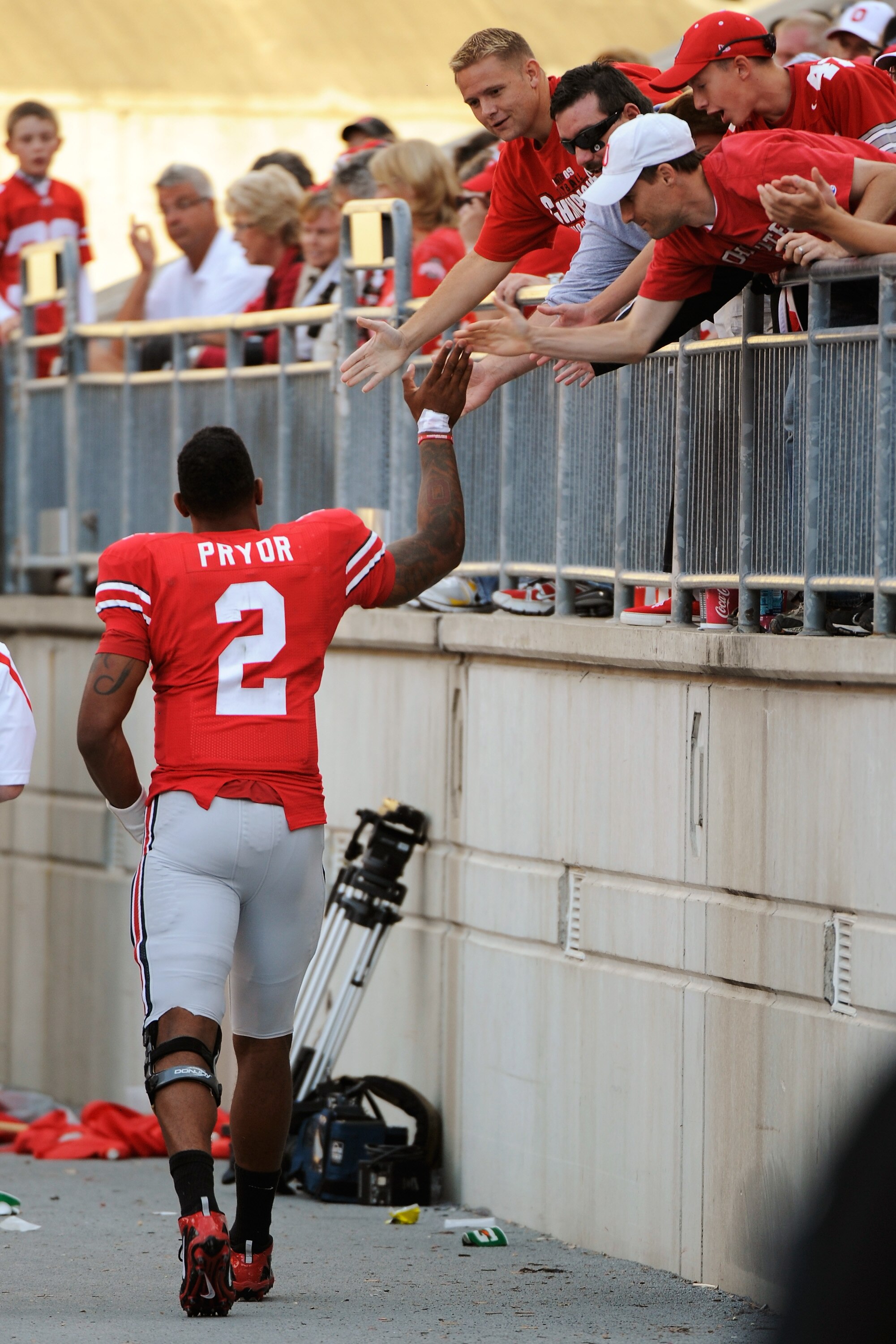 COLUMBUS, OH - SEPTEMBER 25:  Terrelle Pryor #2 of the Ohio State Buckeyes high fives fans as he leaves the field during the game against the Eastern Michigan Eagles at Ohio Stadium on September 25, 2010 in Columbus, Ohio. Pryor threw four touchdown passe