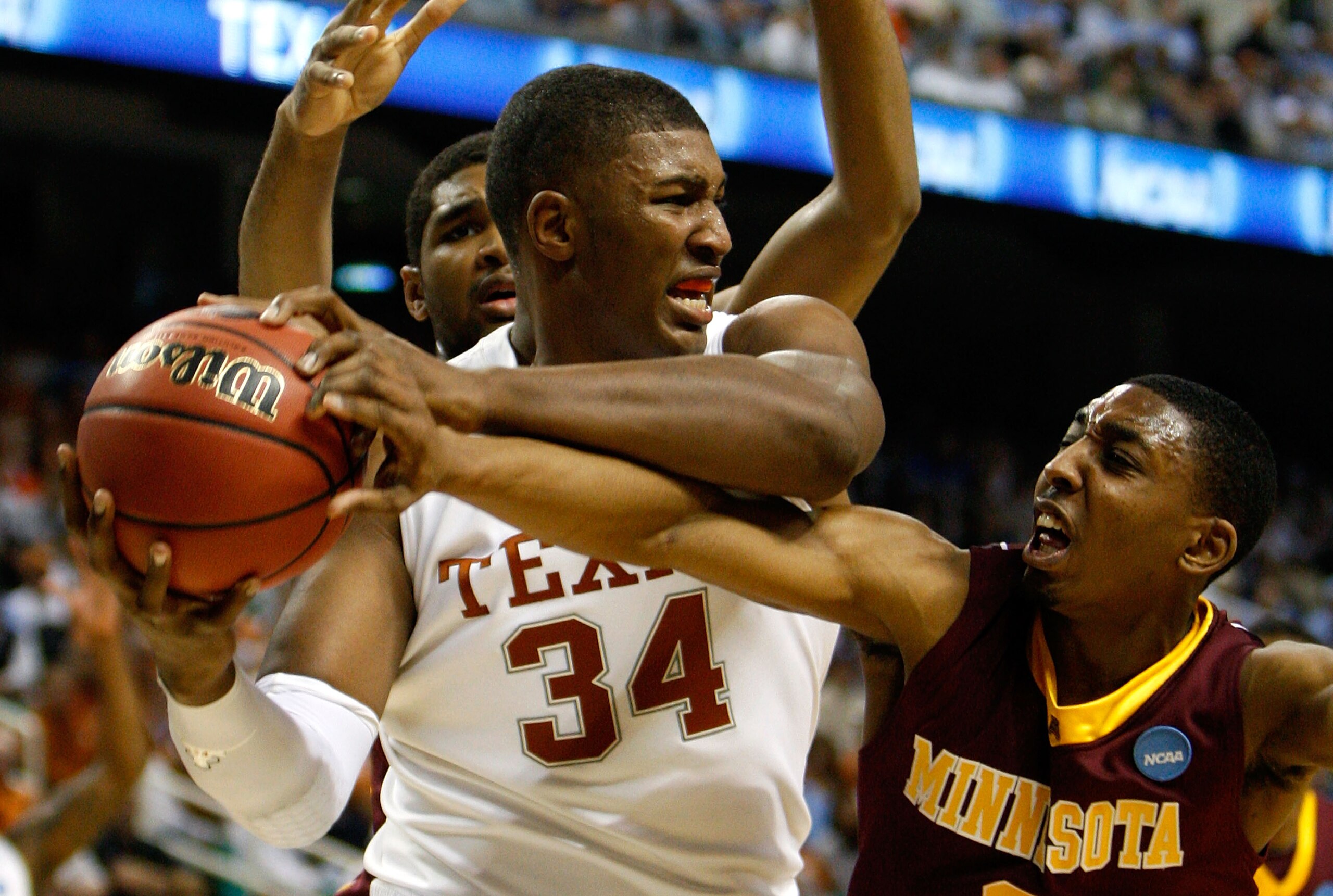 GREENSBORO, NC - MARCH 19: Al Nolen #0 of the Minnesota Golden Gophers reaches in for a steal against Dexter Pittman #34 of the Texas Longhorns during the first round of the NCAA Division I Men's Basketball Tournament at the Greensboro Coliseum on March GREENSBORO, NC - MARCH 19: Al Nolen #0 of the Minnesota Golden Gophers reaches in for a steal against Dexter Pittman #34 of the Texas Longhorns during the first round of the NCAA Division I Men's Basketball Tournament at the Greensboro Coliseum on March
