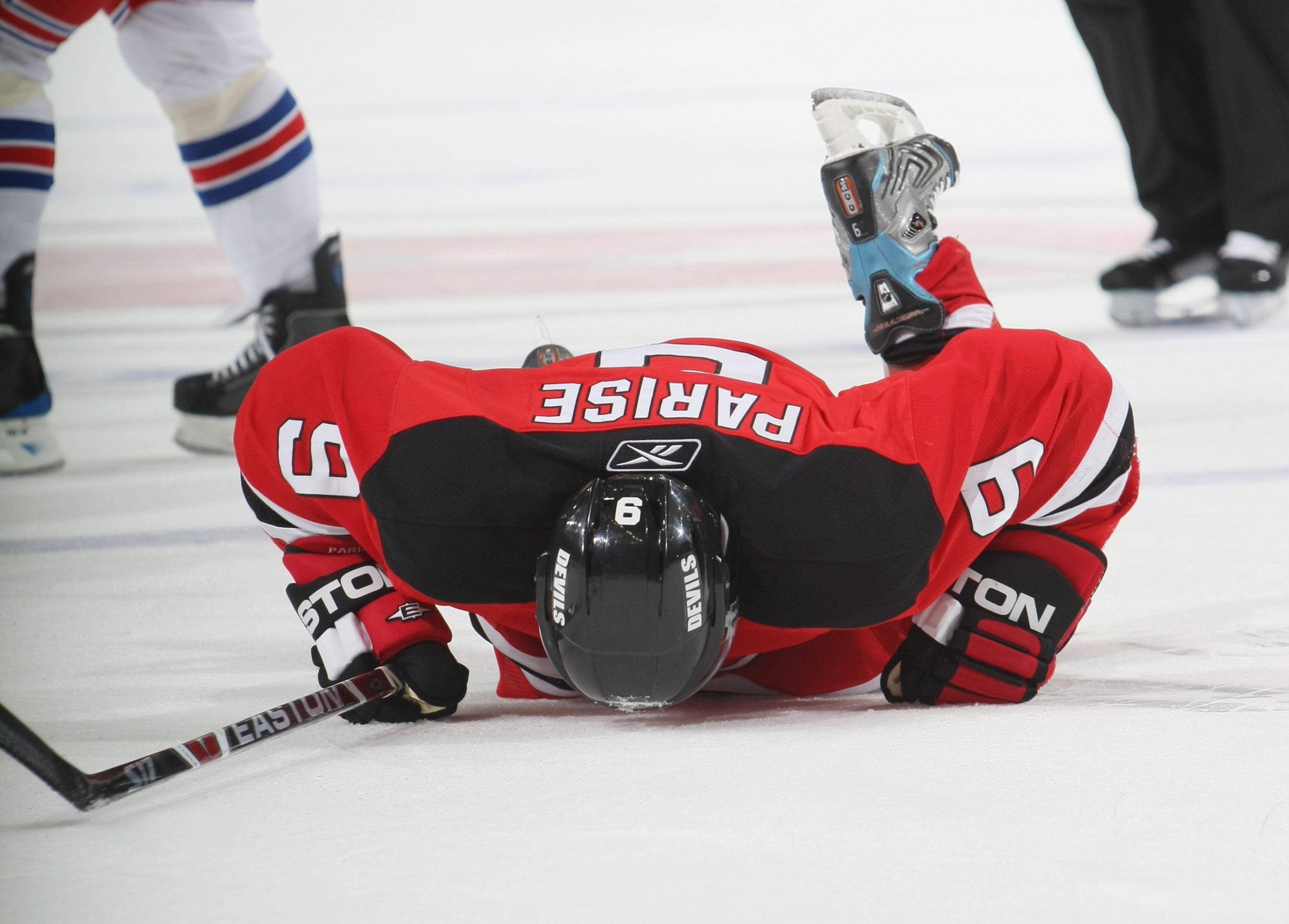 NEWARK, NJ - NOVEMBER 12:  Zach Parise #9 of the New Jersey Devils lays injured on the ice against the New York Rangers during the NHL game on November 12, 2008 at the Prudential Center in Newark, New Jersey.  The Rangers defeated the Devils 5-2. (Photo b