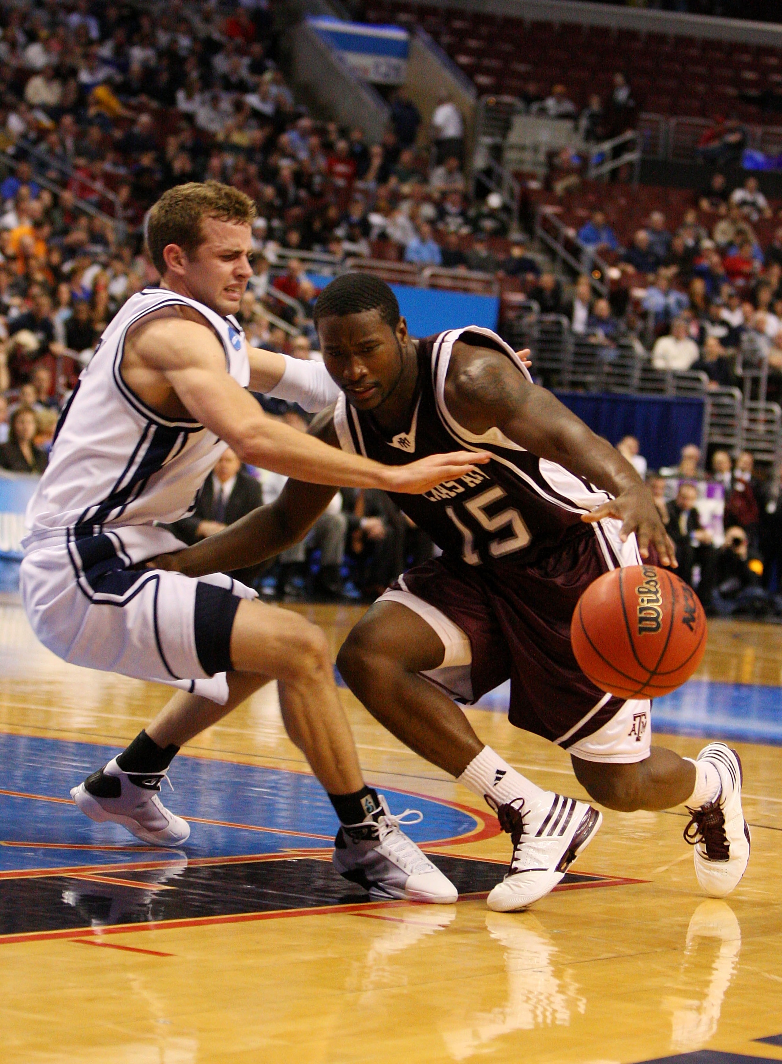 PHILADELPHIA - MARCH 19: Donald Sloan #15 of the Texas A&M Aggies drives against Jackson Emery #4 of the Brigham Young Cougars during the first round of the NCAA Division I Men's Basketball Tournament at the Wachovia Center on March 19, 2009 in Philadelp PHILADELPHIA - MARCH 19: Donald Sloan #15 of the Texas A&M Aggies drives against Jackson Emery #4 of the Brigham Young Cougars during the first round of the NCAA Division I Men's Basketball Tournament at the Wachovia Center on March 19, 2009 in Philadelp