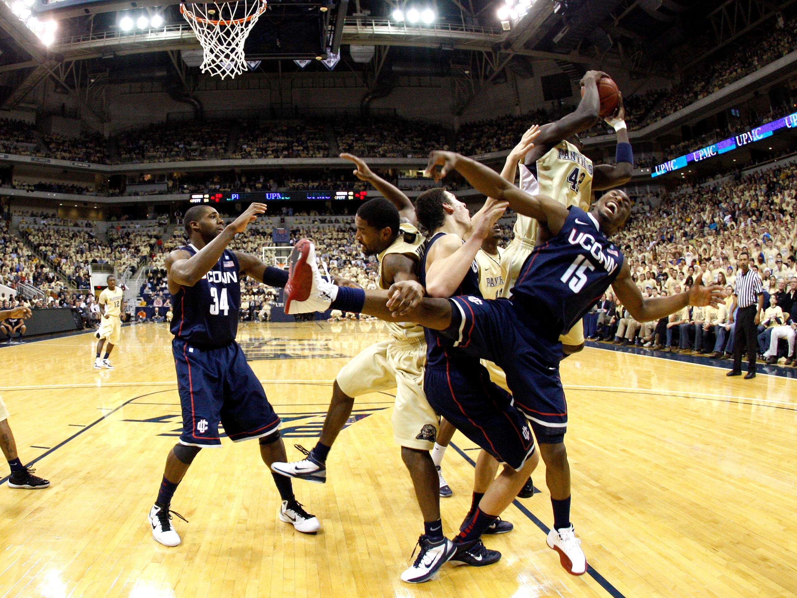 PITTSBURGH, PA - DECEMBER 27: Kemba Walker #15 of the Connecticut Huskies battles for a rebound against Talib Zanna #42 of the Pittsburgh Panthers at Petersen Events Center on December 27, 2010 in Pittsburgh, Pennsylvania. Pittsburgh defeated Connecticu PITTSBURGH, PA - DECEMBER 27: Kemba Walker #15 of the Connecticut Huskies battles for a rebound against Talib Zanna #42 of the Pittsburgh Panthers at Petersen Events Center on December 27, 2010 in Pittsburgh, Pennsylvania. Pittsburgh defeated Connecticu