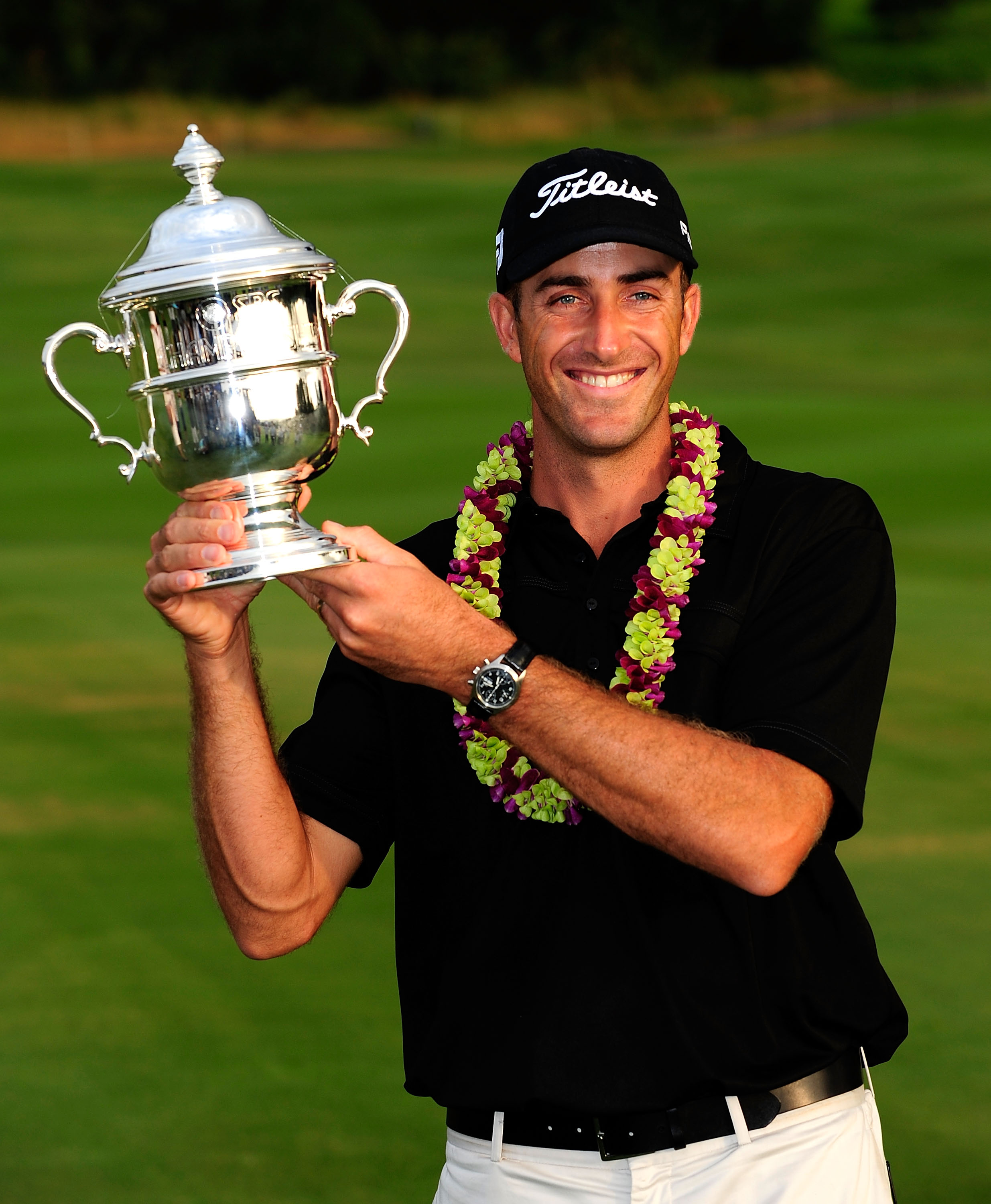 KAPALUA, HI - JANUARY 10:  Geoff Ogilvy of Australia poses with the trophy after winning the SBS Championship at the Plantation course on January 10, 2010 in Kapalua, Maui, Hawaii.  (Photo by Sam Greenwood/Getty Images)