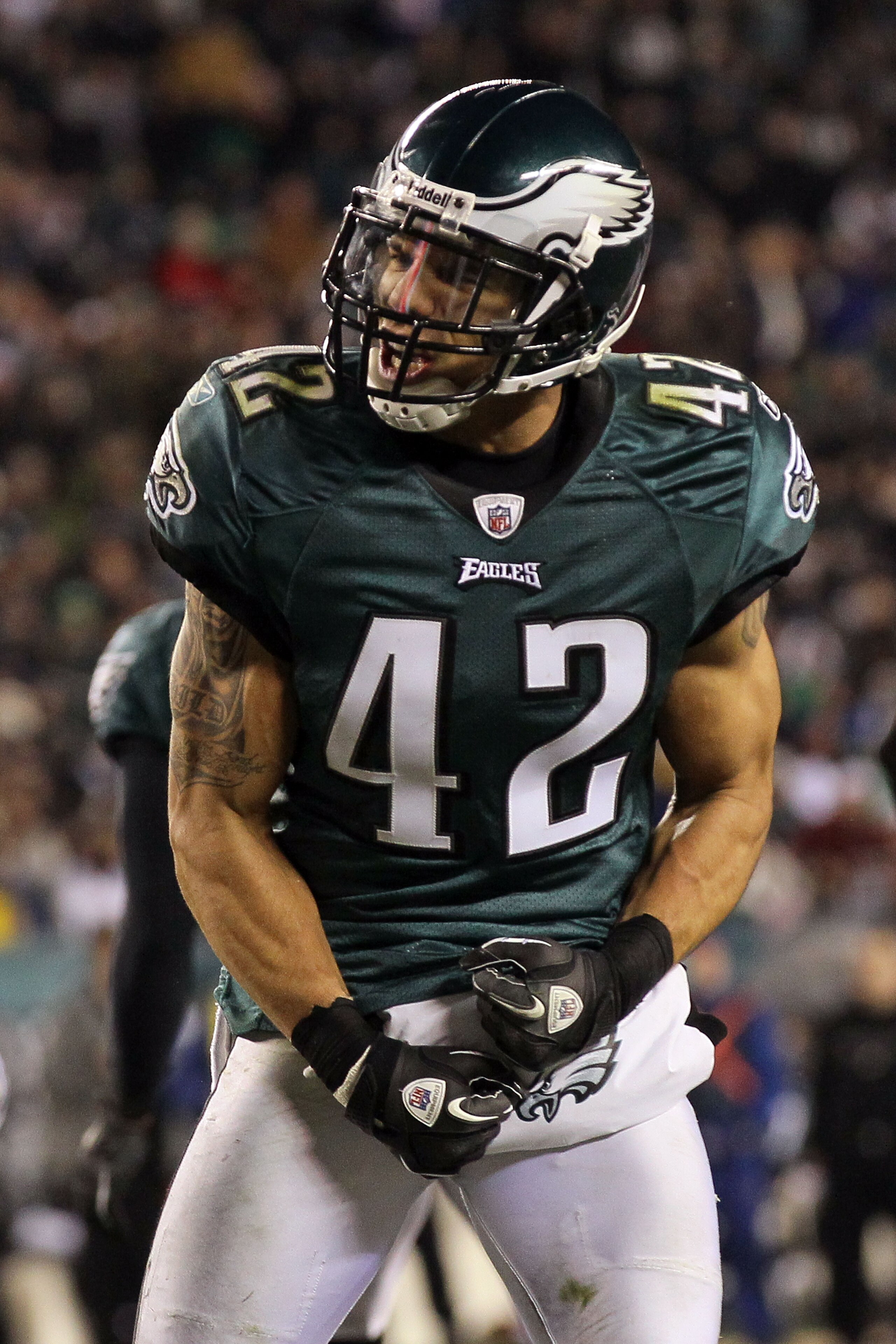 PHILADELPHIA, PA - DECEMBER 28:  Kurt Coleman #42 of the Philadelphia Eagles celebrates after tackling Visanthe Shiancoe #81 of the Minnesota Vikings at Lincoln Financial Field on December 26, 2010 in Philadelphia, Pennsylvania.  (Photo by Jim McIsaac/Get