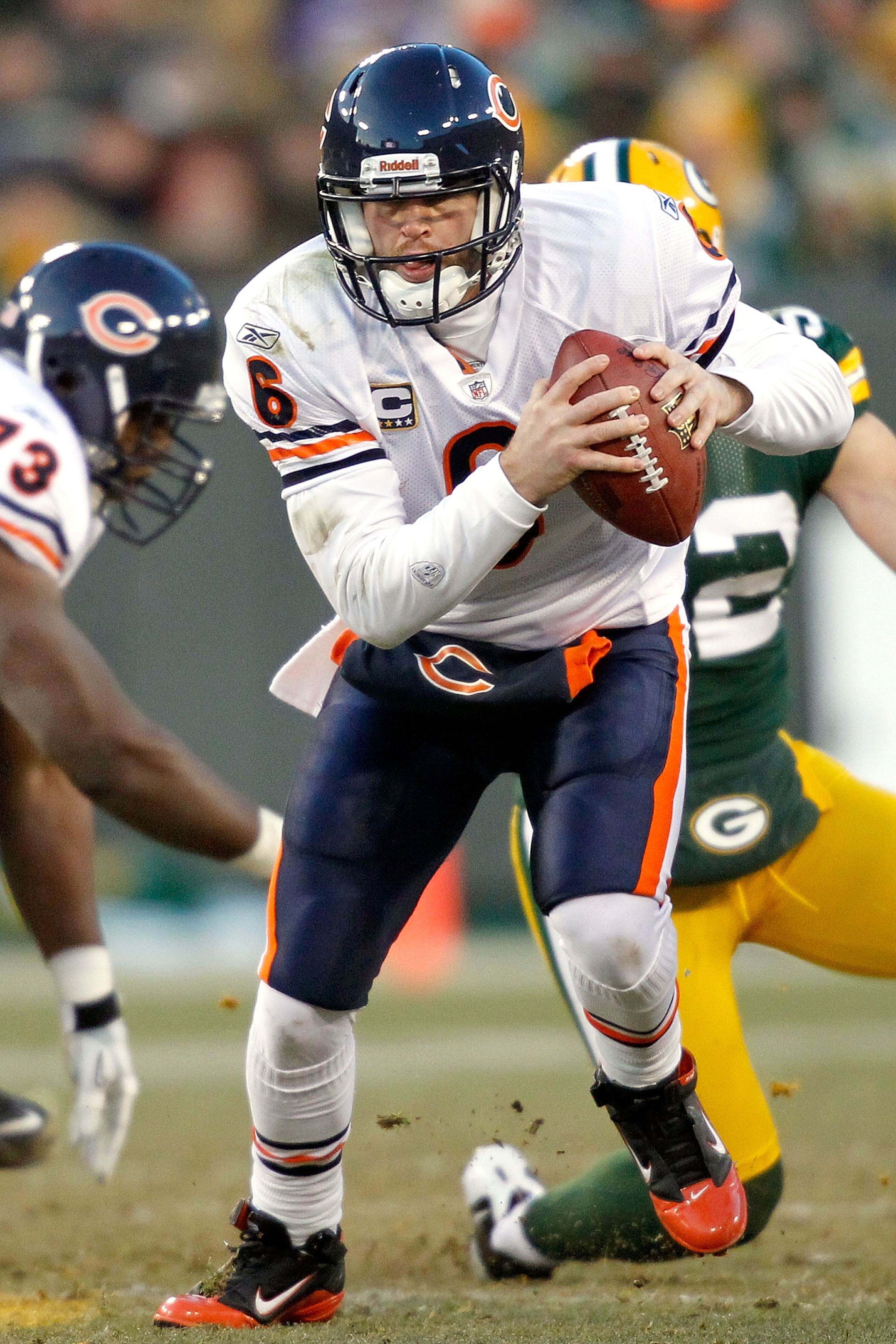 GREEN BAY, WI - JANUARY 02:  Quarterback Jay Cutler #6 of the Chicago Bears is chased out of the pocket by the Green Bay Packers at Lambeau Field on January 2, 2011 in Green Bay, Wisconsin.  (Photo by Matthew Stockman/Getty Images)
