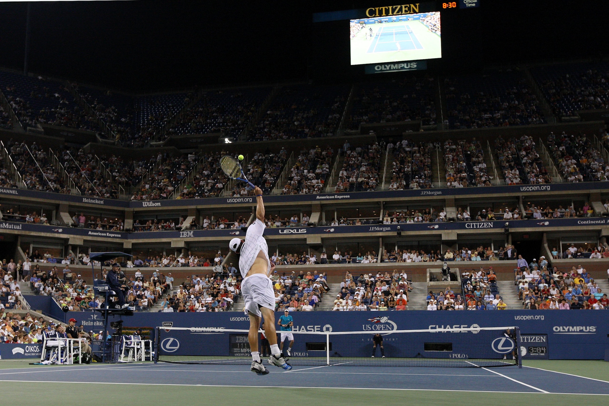 NEW YORK - SEPTEMBER 05: Andy Roddick serves to John Isner during day six of the 2009 U.S. Open at the USTA Billie Jean King National Tennis Center on September 5, 2009 in the Flushing neighborhood of the Queens borough of New York City. (Photo by Jim M NEW YORK - SEPTEMBER 05: Andy Roddick serves to John Isner during day six of the 2009 U.S. Open at the USTA Billie Jean King National Tennis Center on September 5, 2009 in the Flushing neighborhood of the Queens borough of New York City. (Photo by Jim M