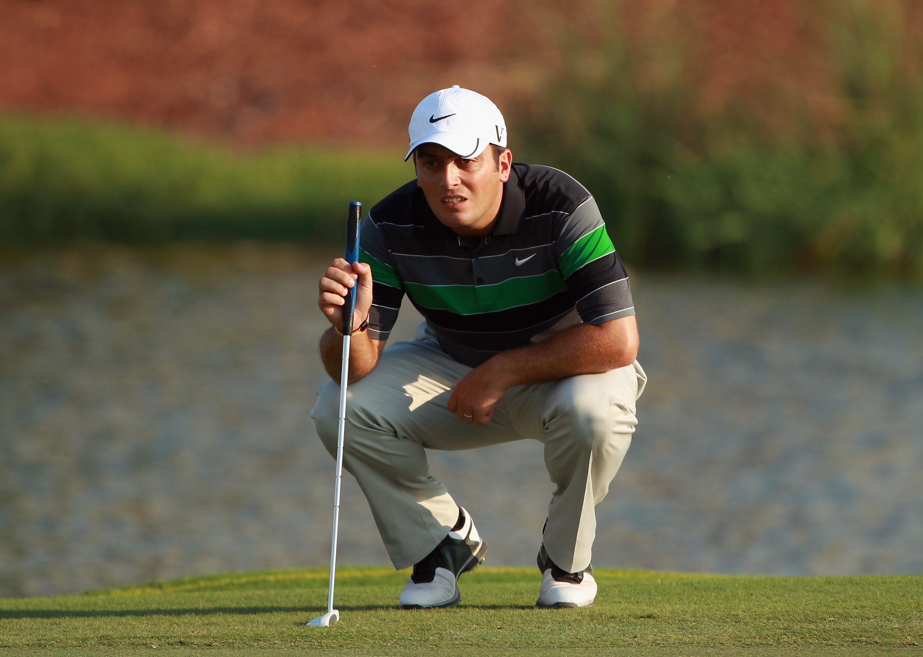 DUBAI, UNITED ARAB EMIRATES - NOVEMBER 27:  Francesco Molinari of Italy lines up a putt on the 17th hole during the third round of the Dubai World Championship on the Earth Course, Jumeirah Golf Estates on November 27, 2010 in Dubai, United Arab Emirates.