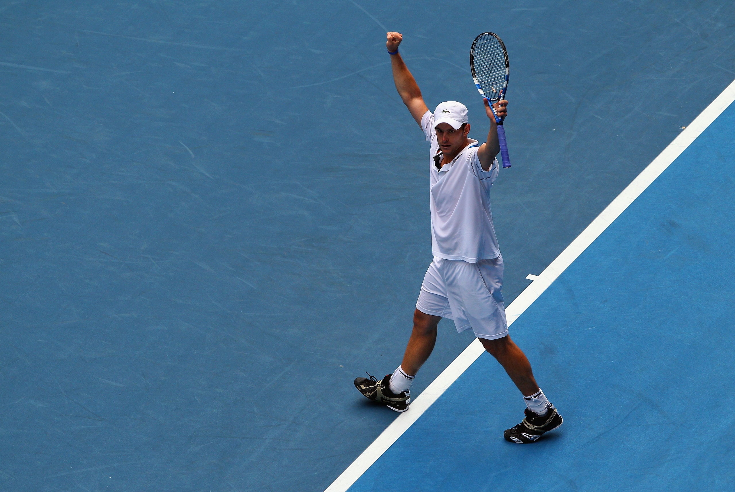 MELBOURNE, AUSTRALIA - JANUARY 22: Andy Roddick of the United States of America celebrates after winning his third round match against Feliciano Lopez of Spain during day five of the 2010 Australian Open at Melbourne Park on January 22, 2010 in Melbourne MELBOURNE, AUSTRALIA - JANUARY 22: Andy Roddick of the United States of America celebrates after winning his third round match against Feliciano Lopez of Spain during day five of the 2010 Australian Open at Melbourne Park on January 22, 2010 in Melbourne
