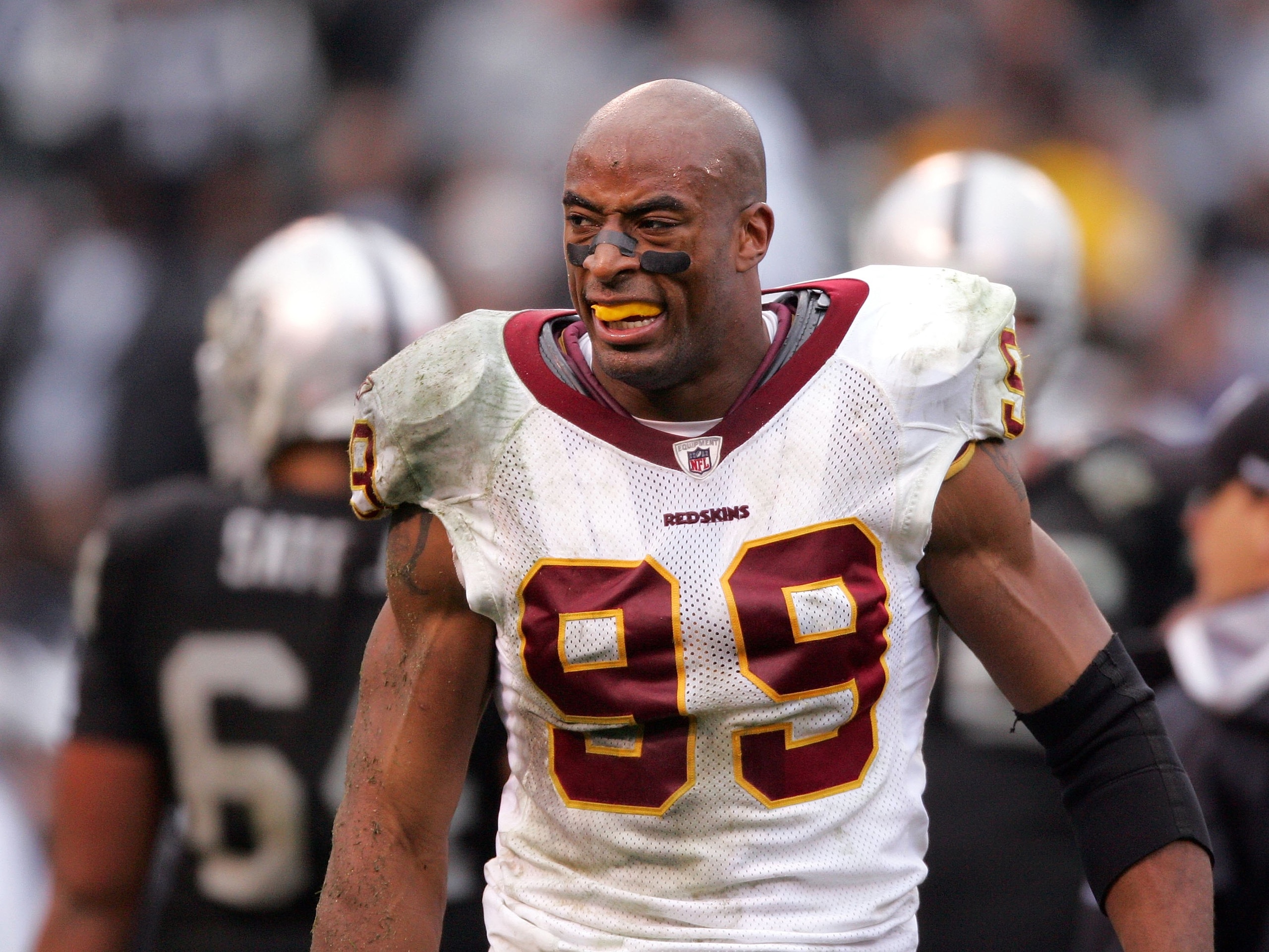 OAKLAND, CA - DECEMBER 13:  Andre Carter #99 of the Washington Redskins stands on the field during their game against the Oakland Raiders at Oakland-Alameda County Coliseum on December 13, 2009 in Oakland, California.  (Photo by Ezra Shaw/Getty Images)