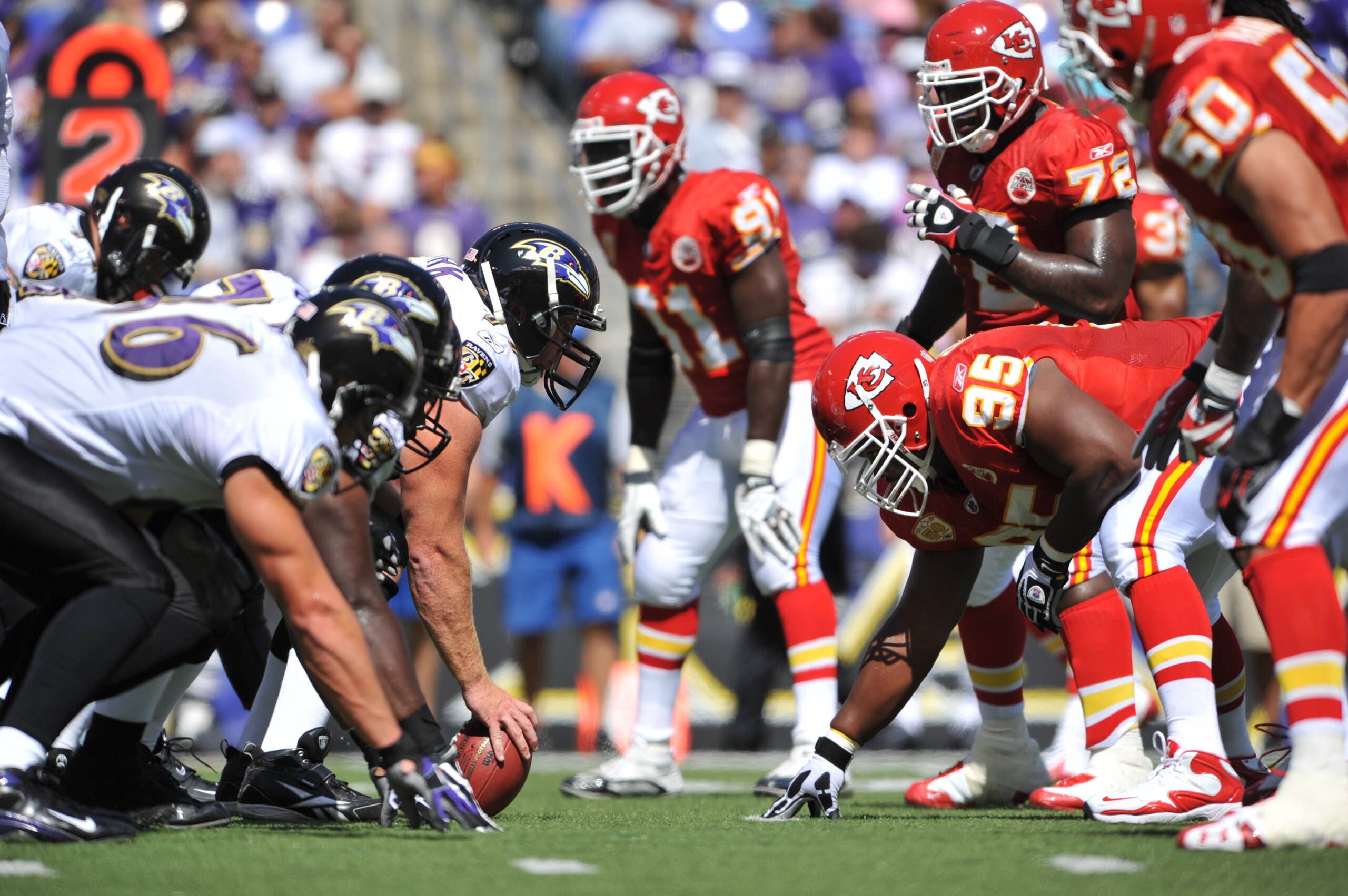 BALTIMORE - SEPTEMBER 13:  Matt Birk #77 of the Baltimore Ravens snaps the ball against the Kansas City Chiefs at M&T Bank Stadium on September 13, 2009 in Baltimore, Maryland. The Ravens defeated the Chiefs 38-24. (Photo by Larry French/Getty Images)