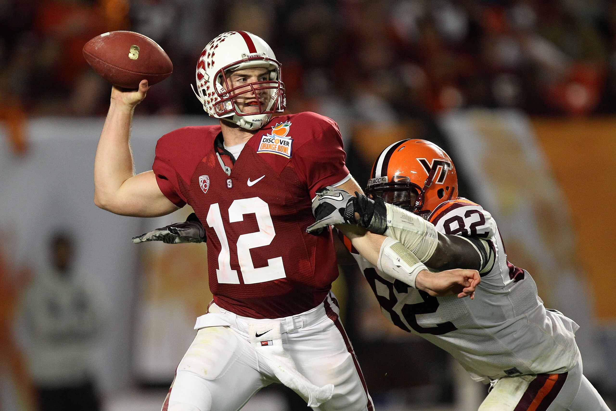 MIAMI, FL - JANUARY 03:  Andrew Luck #12 of the Stanford Cardinal throws a pass against Steven Friday #82 of the Virginai Tech Hokies during the 2011 Discover Orange Bowl at Sun Life Stadium on January 3, 2011 in Miami, Florida.  (Photo by Streeter Lecka/