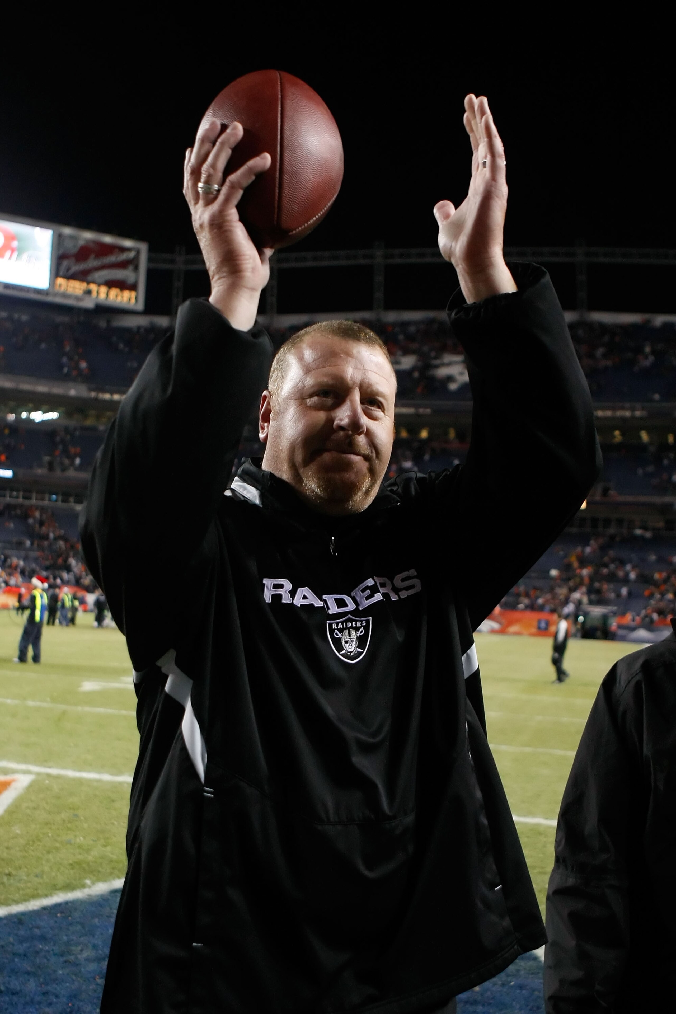DENVER - DECEMBER 20:  Oakland Raiders head coach Tom Cable celebrates a victory over the Denver Broncos at Invesco Field at Mile High on December 20, 2009 in Denver, Colorado. The Raiders defeated the Broncos 20-19.  (Photo by Jeff Gross/Getty Images)