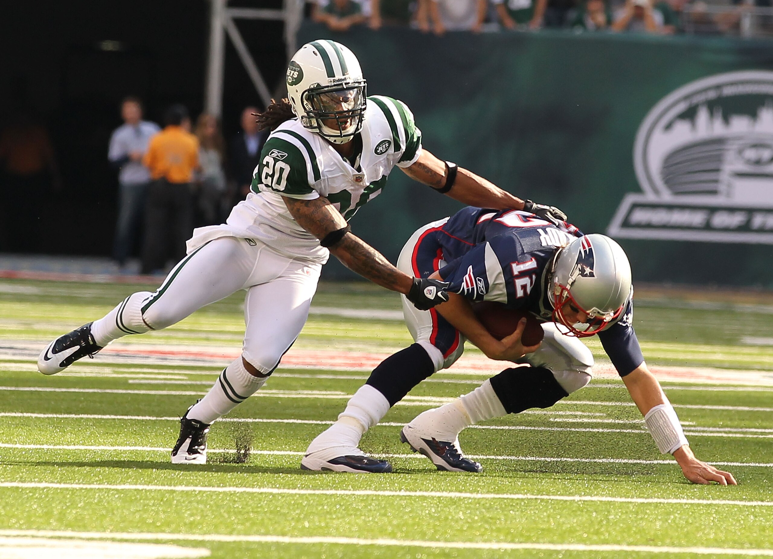 EAST RUTHERFORD, NJ - SEPTEMBER 19:  Kyle Wilson #20 of the New York Jets misses sacking Tom Brady #12 of the New England Patriots during their  game on September 19, 2010 at the New Meadowlands Stadium  in East Rutherford, New Jersey.  (Photo by Al Bello