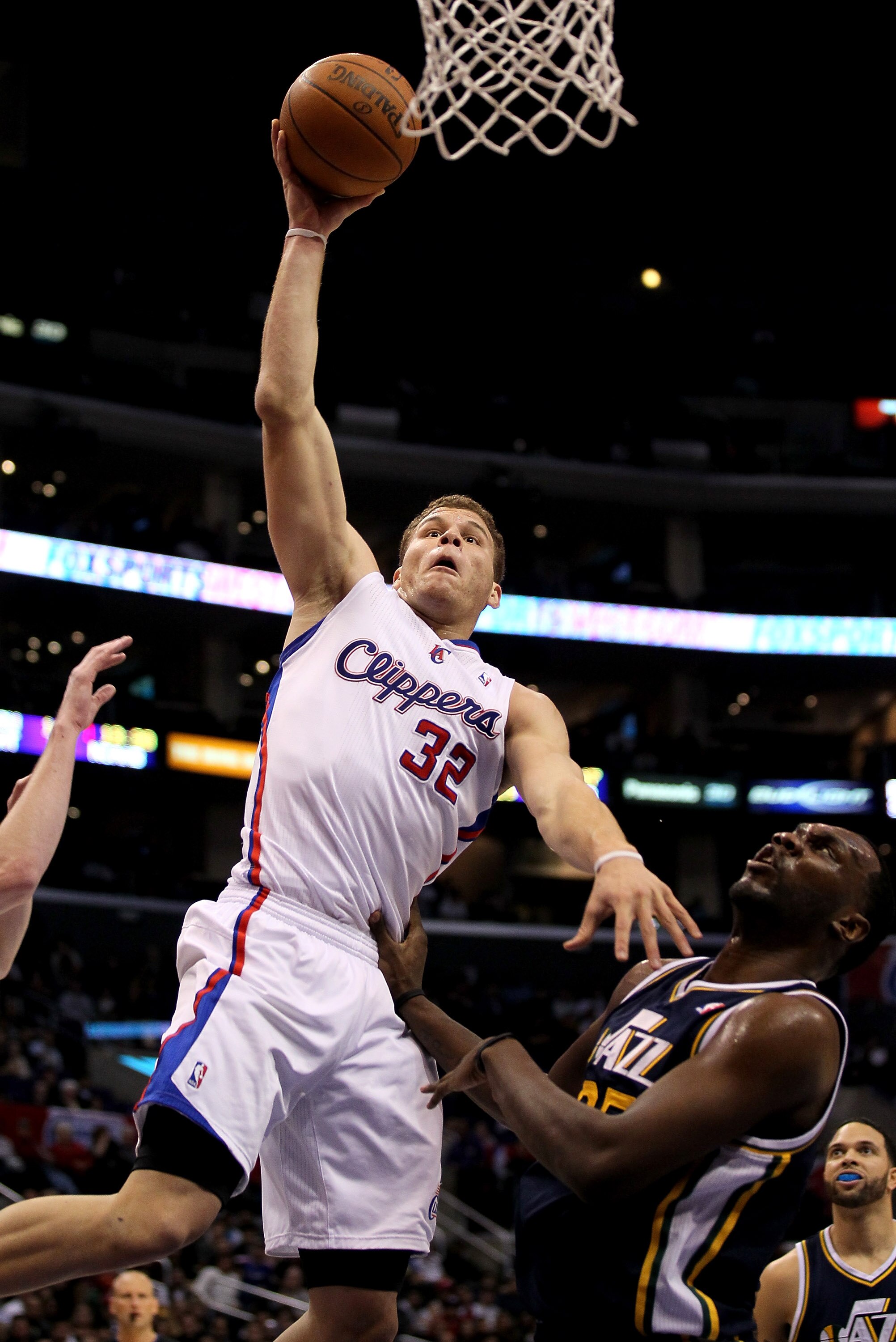 LOS ANGELES, CA - DECEMBER 29:  Blake Griffin #32 of the Los Angeles Clippers goes up for a dunk over Al Jefferson #25 of the Utah Jazz at Staples Center on December 29, 2010 in Los Angeles, California.    NOTE TO USER: User expressly acknowledges and agr