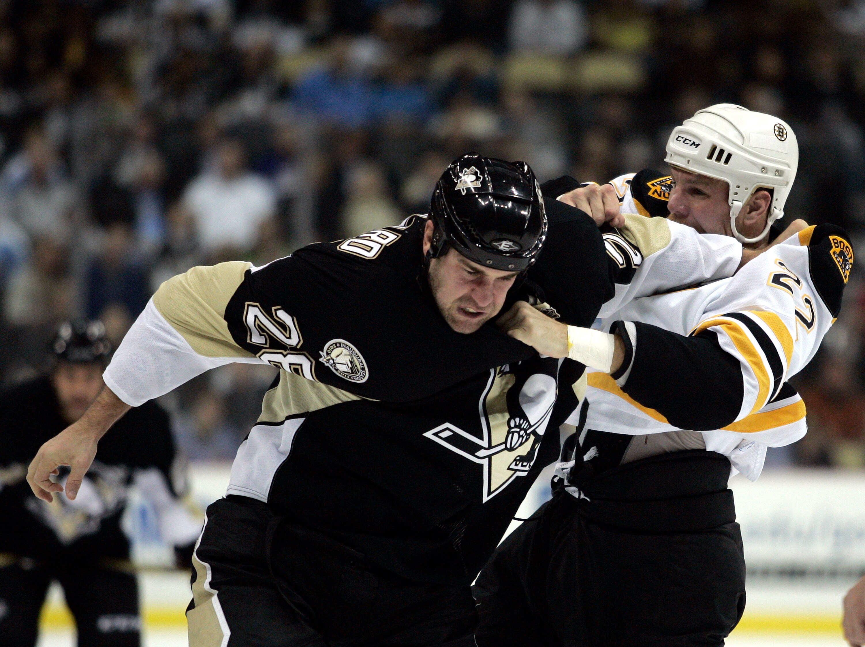PITTSBURGH - NOVEMBER 10:  Eric Godard #28 of the Pittsburgh Penguins mixes it up with Shawn Thornton #22 of the Boston Bruins at Consol Energy Center on November 10, 2010 in Pittsburgh, Pennsylvania.  (Photo by Justin K. Aller/Getty Images)