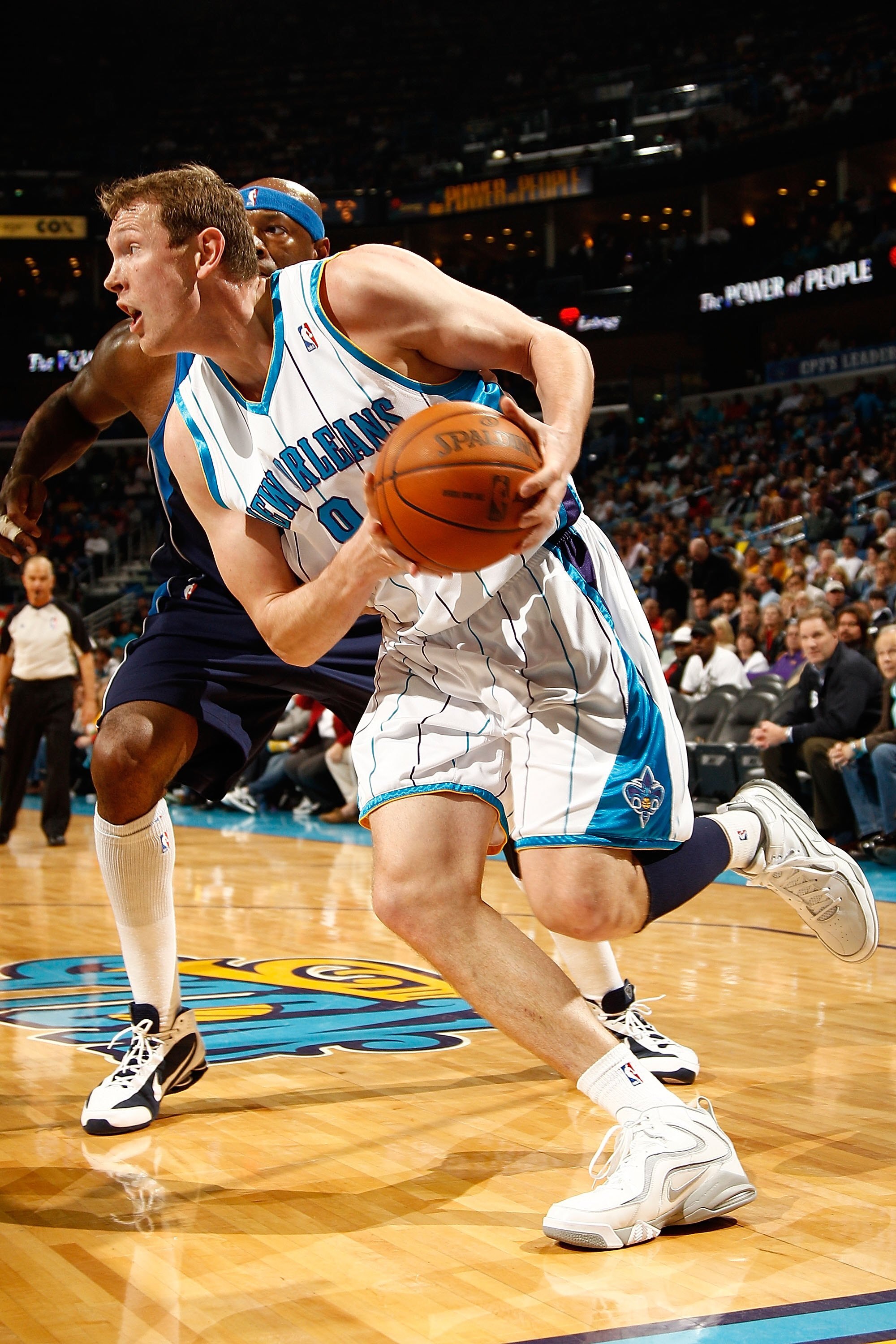 NEW ORLEANS - MARCH 22:  Darius Songaila #9 of the New Orleans Hornets drives the ball during the game against the Dallas Mavericks at the New Orleans Arena on March 22, 2010 in New Orleans, Louisiana.  NOTE TO USER: User expressly acknowledges and agrees