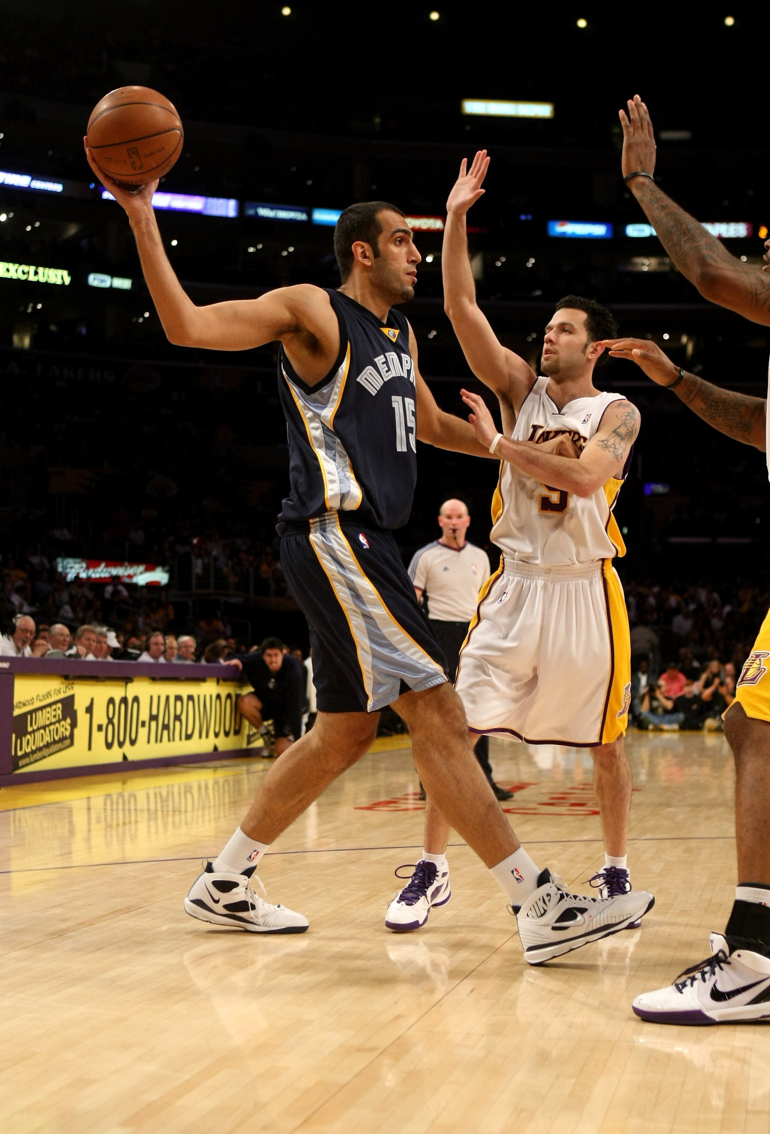 LOS ANGELES - APRIL 12: Hamed Haddadi #15 of the Memphis Grizzlies controls the ball against Jordan Farmar #5 of the Los Angeles Lakers on April 12, 2009 at Staples Center in Los Angeles, California. The Lakers won 92-75. NOTE TO USER: User expressly a LOS ANGELES - APRIL 12: Hamed Haddadi #15 of the Memphis Grizzlies controls the ball against Jordan Farmar #5 of the Los Angeles Lakers on April 12, 2009 at Staples Center in Los Angeles, California. The Lakers won 92-75. NOTE TO USER: User expressly a