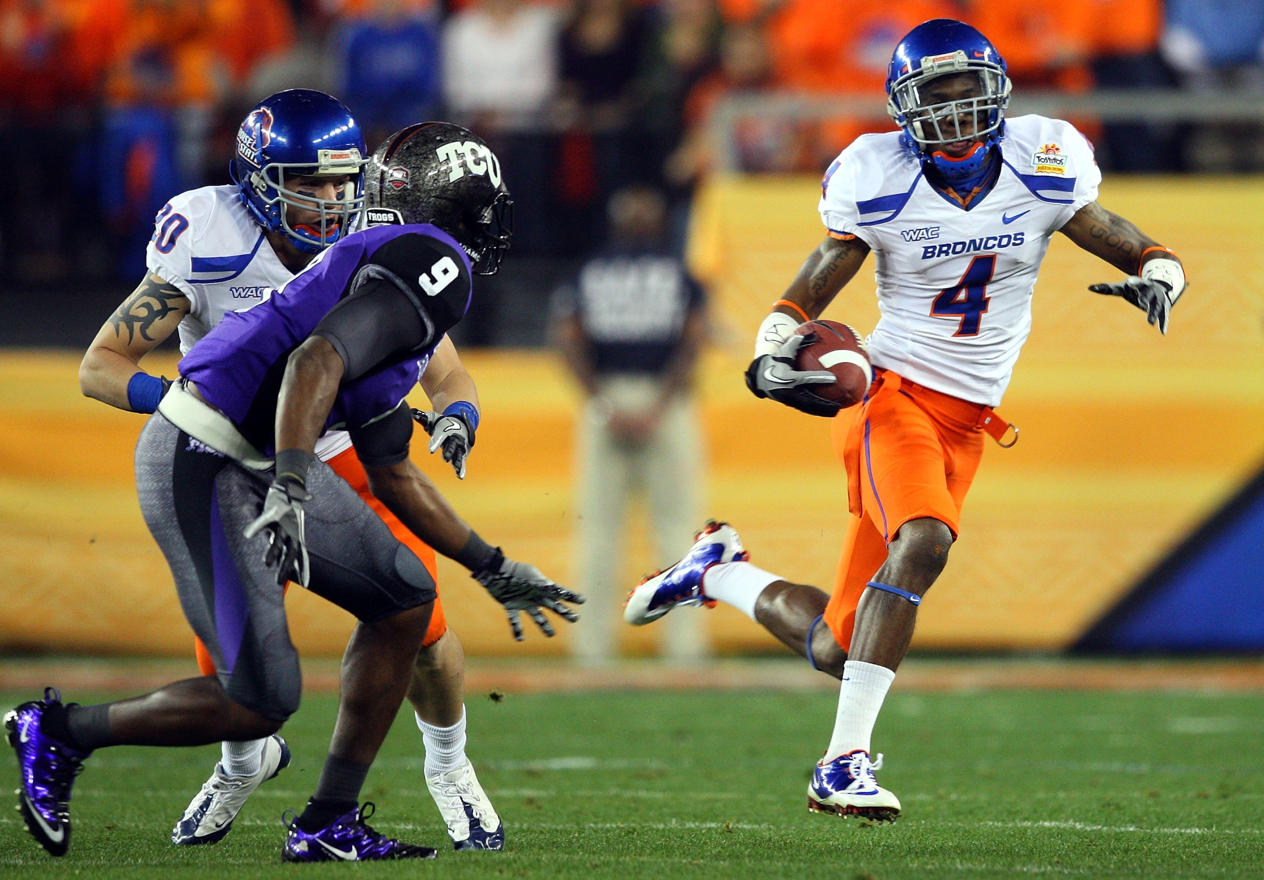 GLENDALE, AZ - JANUARY 04:  Titus Young #4 of the Boise State Broncos runs after a catch against the TCU Horned Frogs in the first half during the Tostitos Fiesta Bowl at the Universtity of Phoenix Stadium on January 4, 2010 in Glendale, Arizona.  (Photo