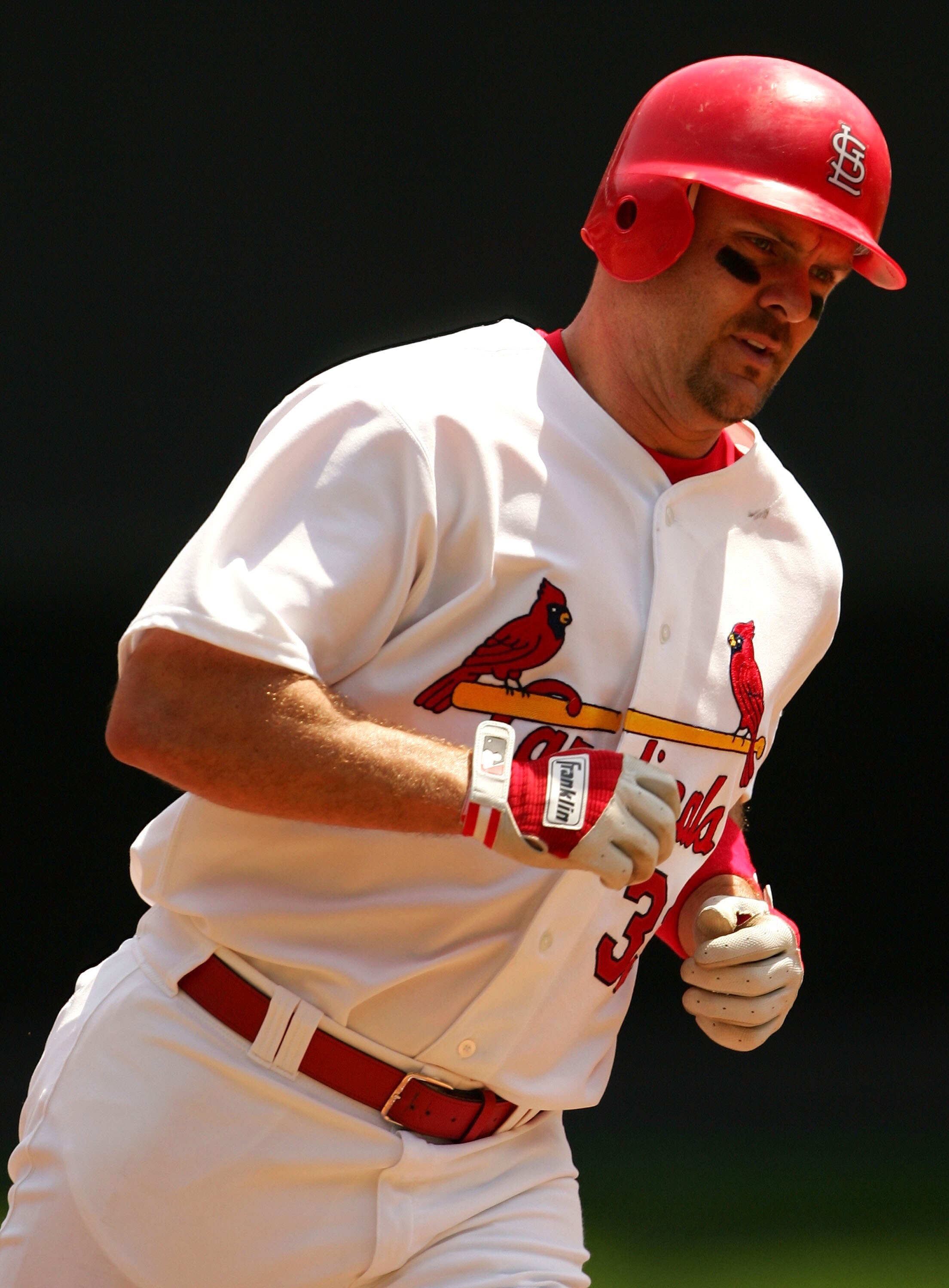 ST. LOUIS - MAY 7:  Larry Walker #33 of the St. Louis Cardinals rounds third base after he hit a solo home run in the first inning against the San Diego Padres on May 7, 2005 at Busch Stadium in St. Louis, Missouri.  (Photo by Elsa/Getty Images)