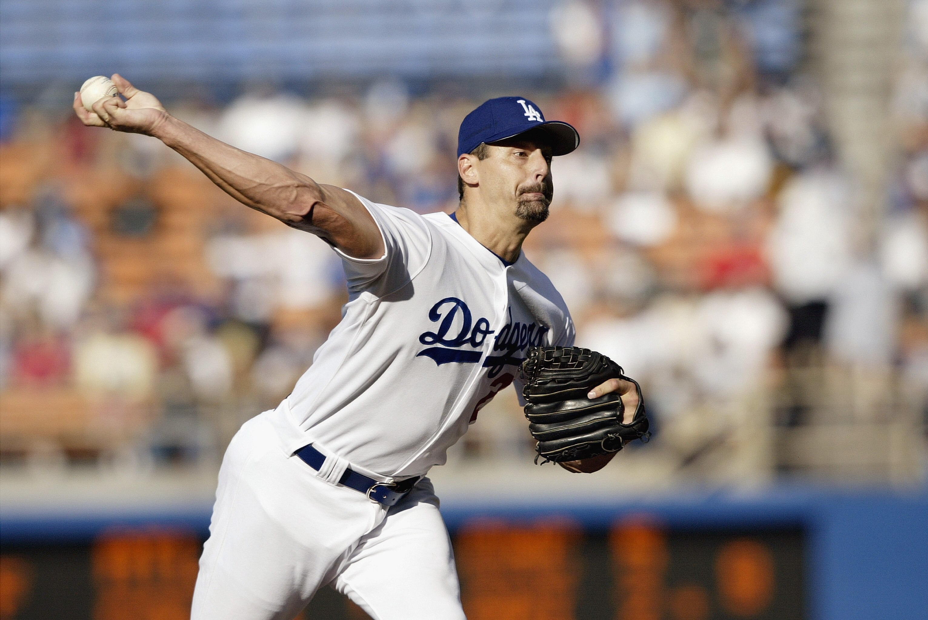 LOS ANGELES - AUGUST 24:  Starting pitcher Kevin Brown #27 of the Los Angeles Dodgers delivers a pitch during the National League game against the New York Mets at Dodgers Stadium on August 24, 2003 in Los Angeles, California. The Mets defeated the Dodger