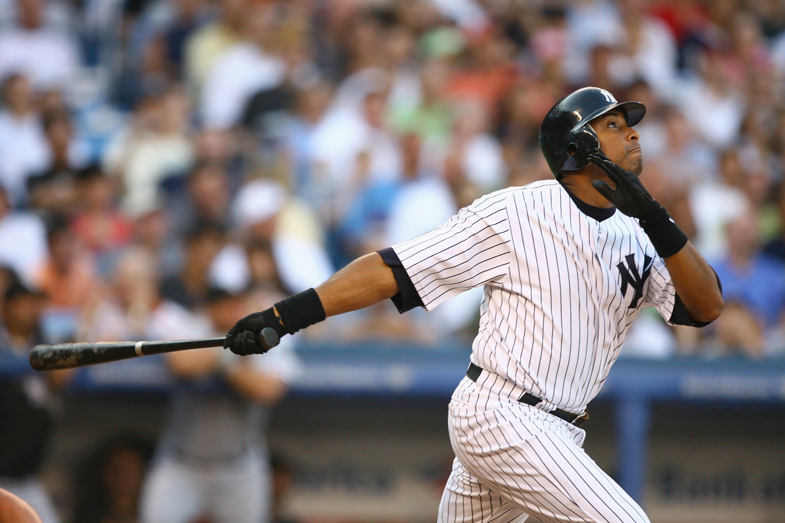 NEW YORK - JULY 14: Bernie Williams #51 of the New York Yankees watches the flight of the ball during the game with  the Chicago White Sox on July 14, 2006 at Yankee Stadium in the Bronx borough of New York City.  The Yankees won 6-5. (Photo by Al Bello/G