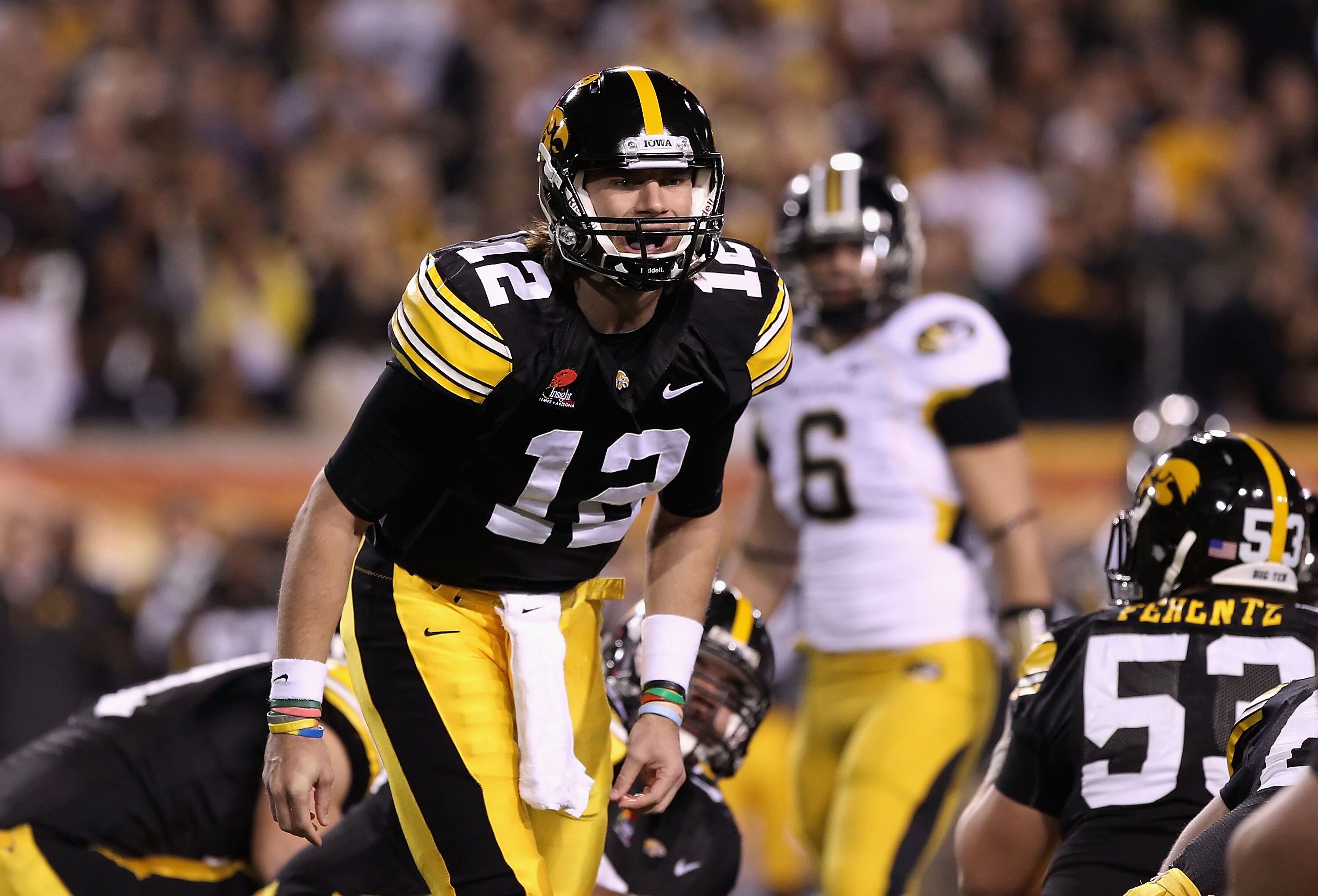 TEMPE, AZ - DECEMBER 28:  Quarterback Ricky Stanzi #12 of the Iowa Hawkeyes calls a play during the Insight Bowl against the Missouri Tigers at Sun Devil Stadium on December 28, 2010 in Tempe, Arizona.  (Photo by Christian Petersen/Getty Images)