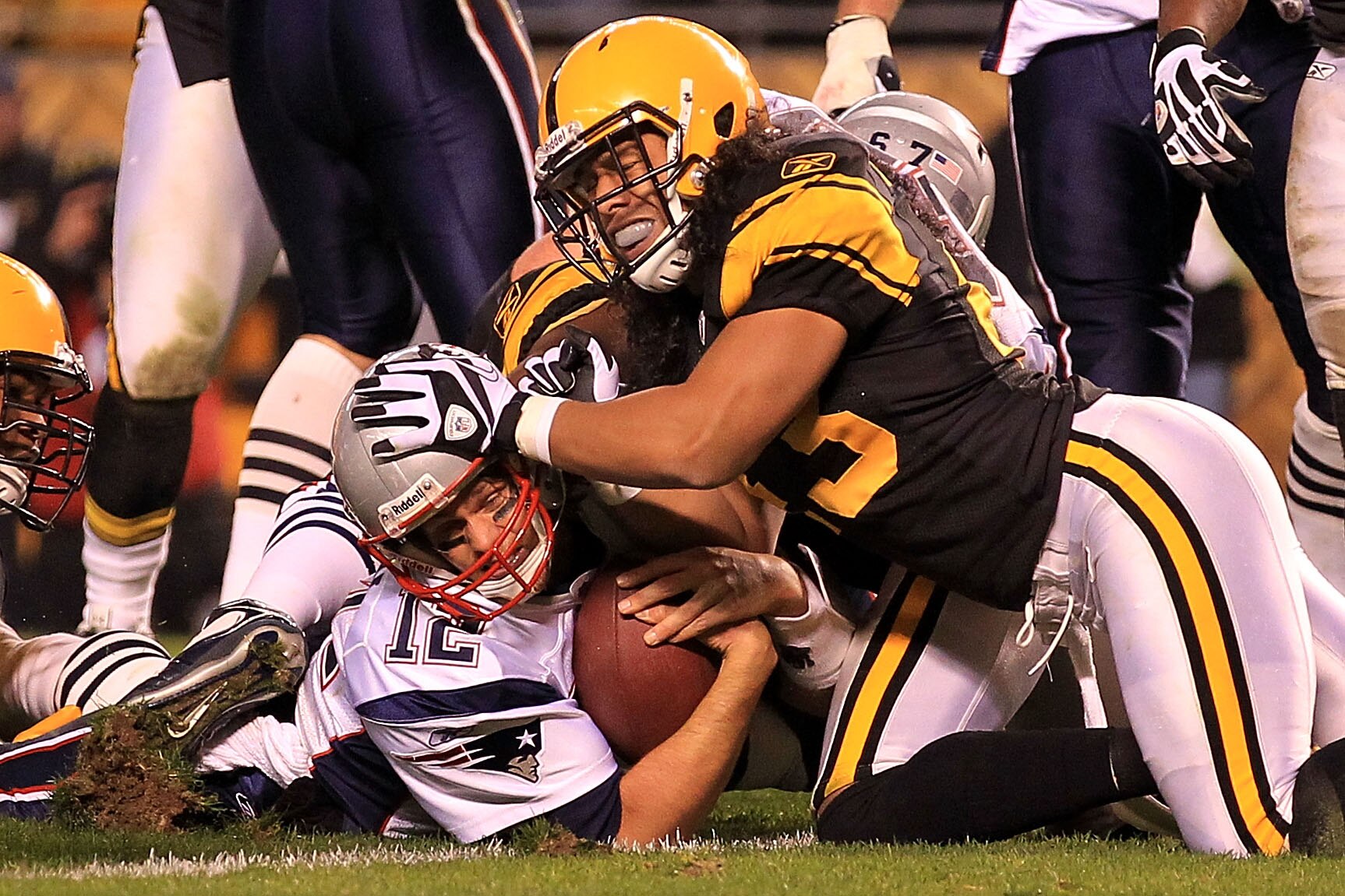 PITTSBURGH - NOVEMBER 14:  Tom Brady #12 of the New England Patriots scores a touchdown under pressure from Troy Polamalu #43 of the Pittsburgh Steelers on November 14, 2010 at Heinz Field in Pittsburgh, Pennsylvania.  (Photo by Chris McGrath/Getty Images