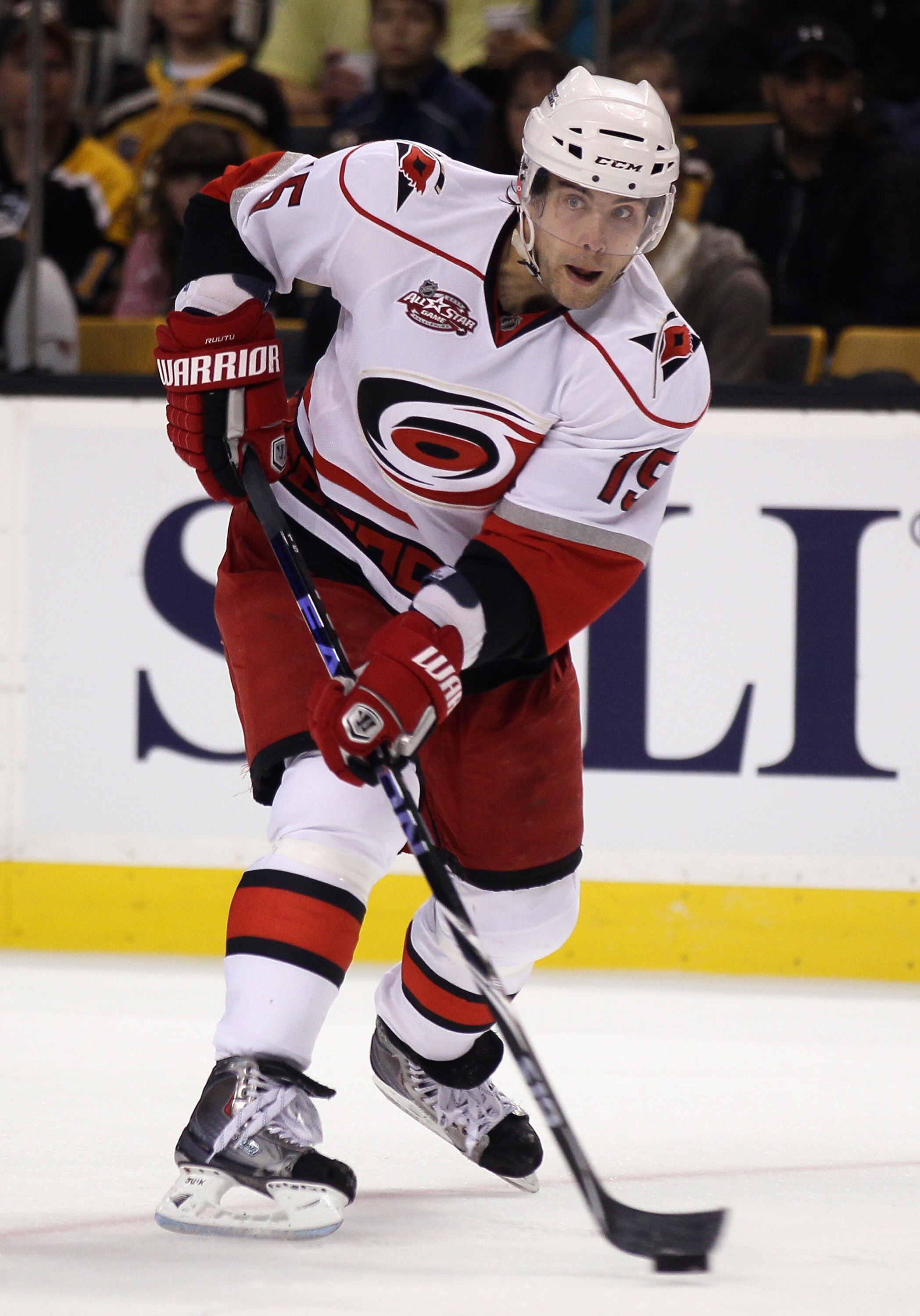 BOSTON - NOVEMBER 26:  Tuomo Ruutu #15 of the Carolina Hurricanes takes the puck in the second period against the Boston Bruins on November 26, 2010 at the TD Garden in Boston, Massachusetts.  (Photo by Elsa/Getty Images)