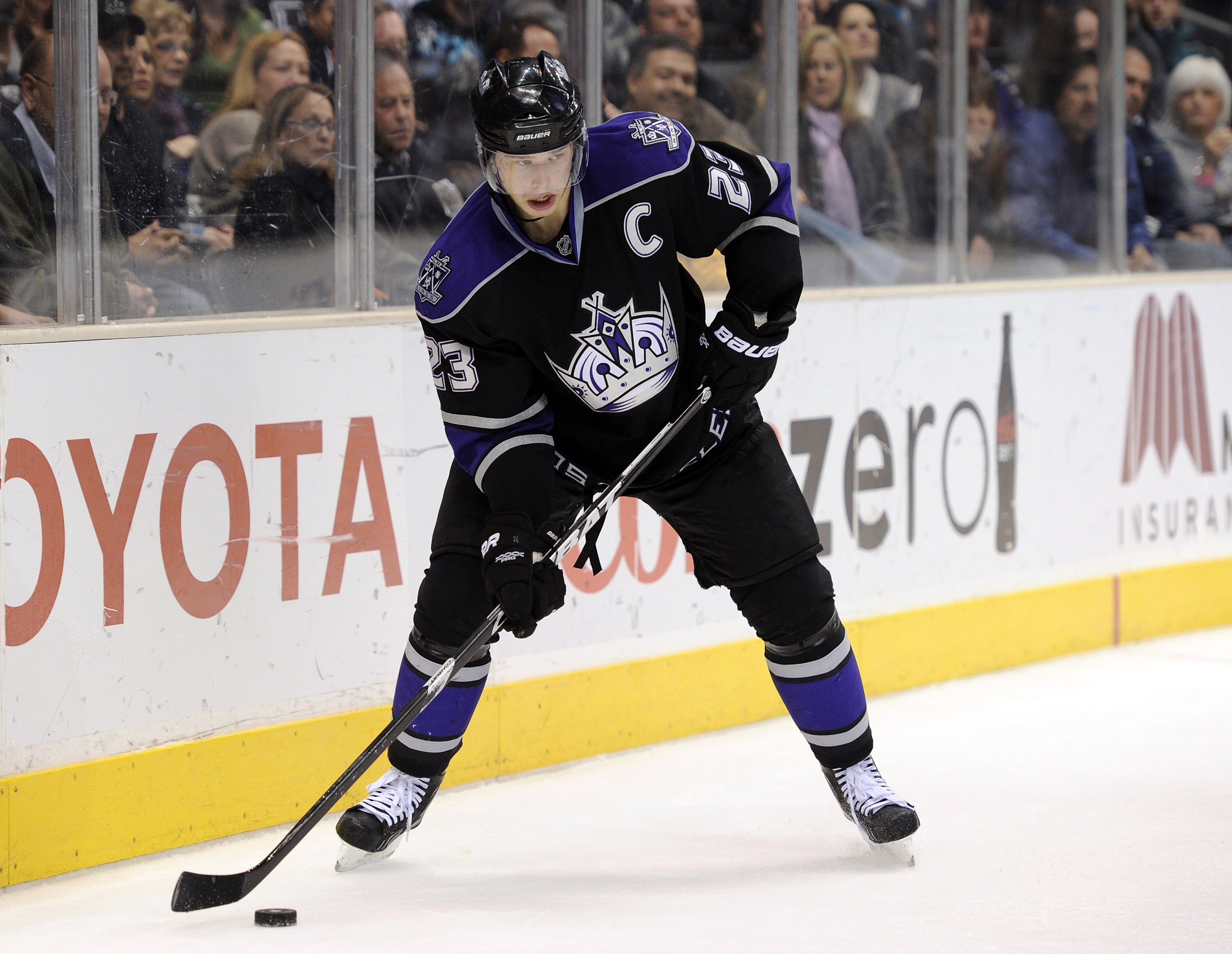 LOS ANGELES, CA - DECEMBER 11:  Dustin Brown #23 of the Los Angeles Kings looks to center the puck against the Minnesota Wild during the game at the Staples Center on December 11, 2010 in Los Angeles, California.  (Photo by Harry How/Getty Images)