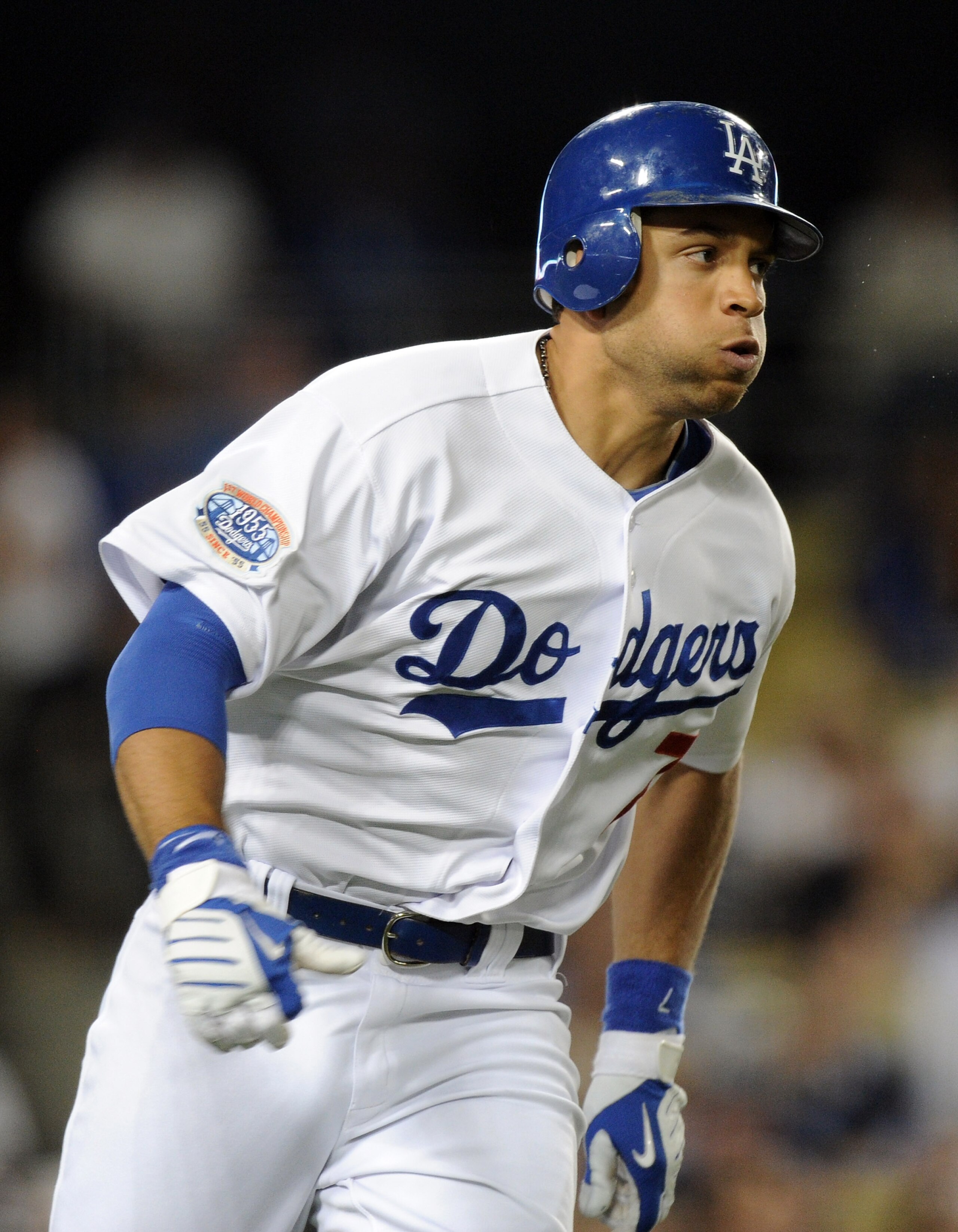 LOS ANGELES, CA - AUGUST 17:  James Loney #7 of the Los Angeles Dodgers hits a two run double against the Colorado Rockies during the fifth inning at Dodger Stadium on August 17, 2010 in Los Angeles, California.  (Photo by Harry How/Getty Images)