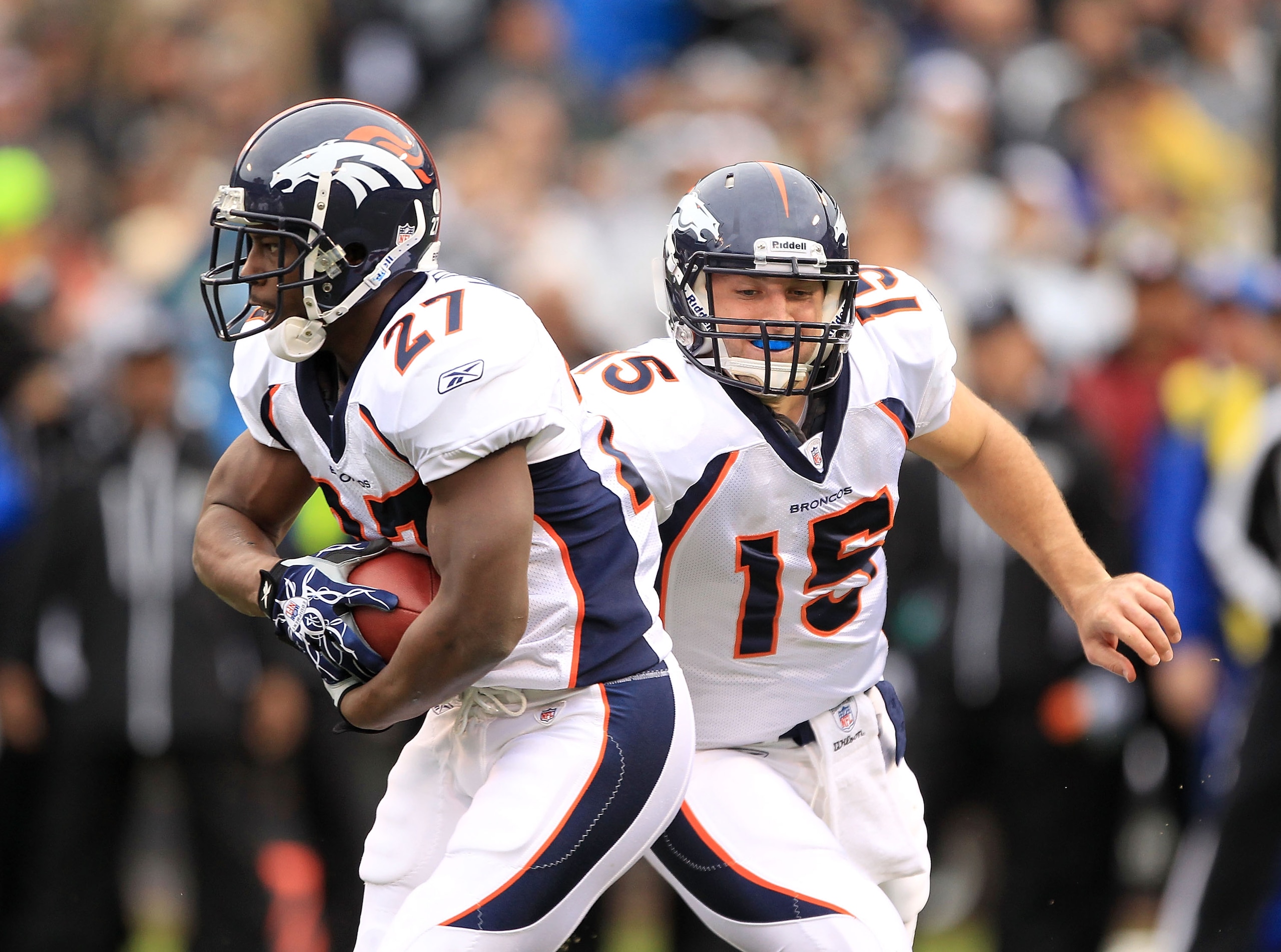 OAKLAND, CA - DECEMBER 19:  Tim Tebow #15 of the Denver Broncos hands off to Knowshon Moreno #27 during their game against the Oakland Raiders at Oakland-Alameda County Coliseum on December 19, 2010 in Oakland, California.  (Photo by Ezra Shaw/Getty Image