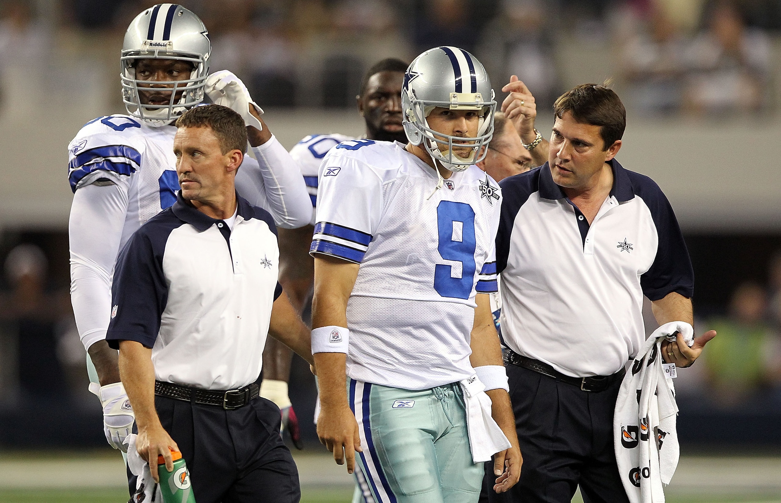 ARLINGTON, TX - OCTOBER 25:  Quarterback Tony Romo #9 of the Dallas Cowboys leaves the game after a left shoulder injury in the second quarter against the New York Giants at Cowboys Stadium on October 25, 2010 in Arlington, Texas.  (Photo by Ronald Martin
