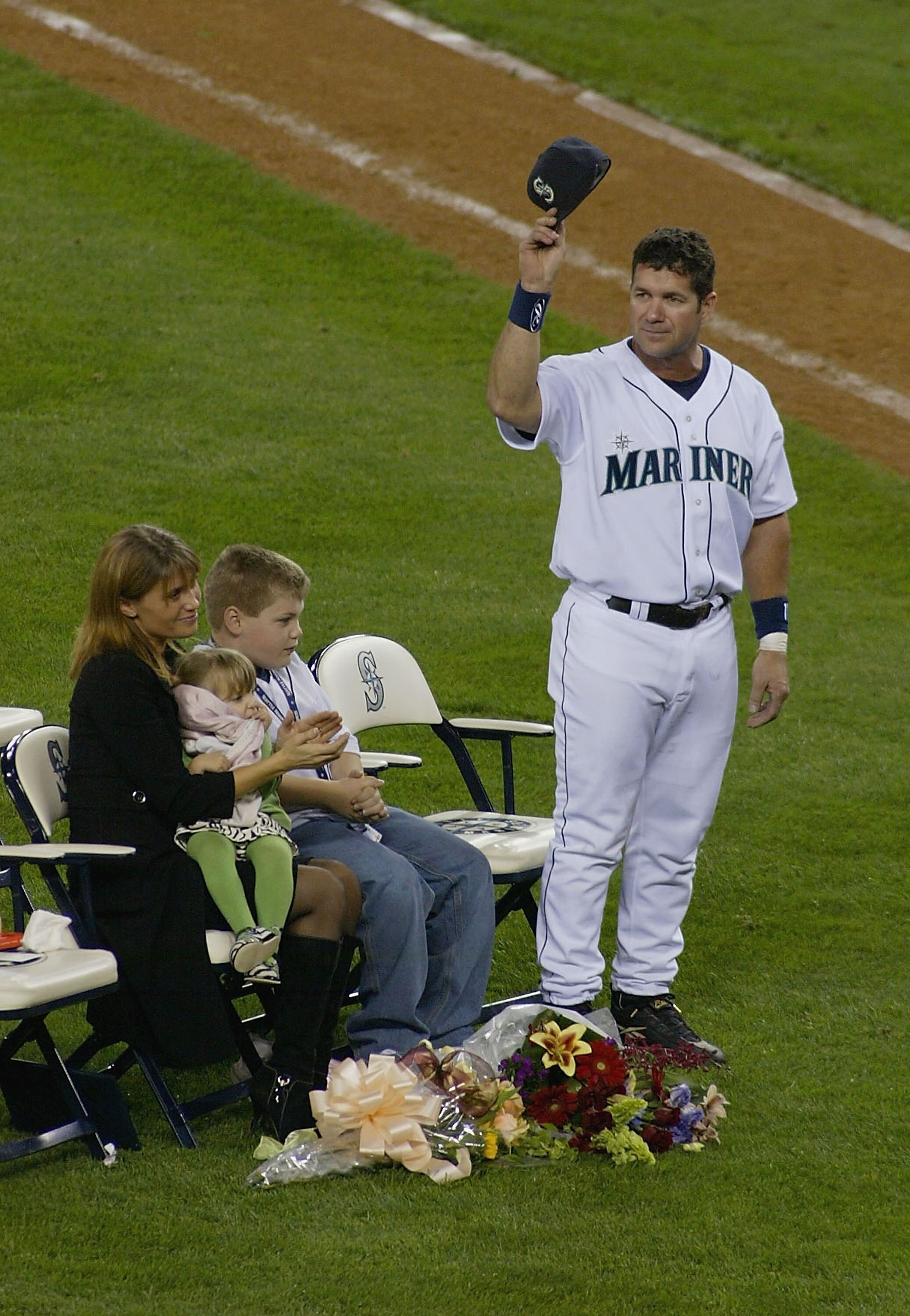 SEATTLE, WA - OCTOBER 2:  Edgar Martinez #11 of the Seattle Mariners (and his family) acknowledges the crowd during a post game ceremony honoring his 18 year career with the Mariners on October 2, 2004 at Safeco Field in Seattle, Washington.  (Photo by Li