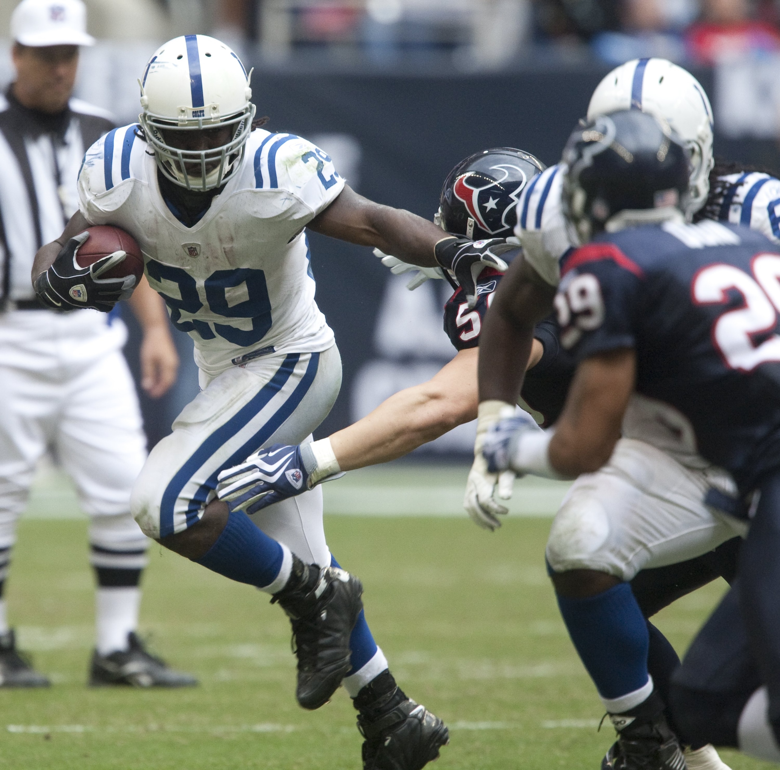 HOUSTON - NOVEMBER 29: Running back Joseph Addai #29 of the indianapolis Colts pushes aside linebacker Brian Cushing #56 of the Houston Texans at Reliant Stadium on November 29, 2009 in Houston, Texas. (Photo by Bob Levey/Getty Images) HOUSTON - NOVEMBER 29: Running back Joseph Addai #29 of the indianapolis Colts pushes aside linebacker Brian Cushing #56 of the Houston Texans at Reliant Stadium on November 29, 2009 in Houston, Texas. (Photo by Bob Levey/Getty Images)