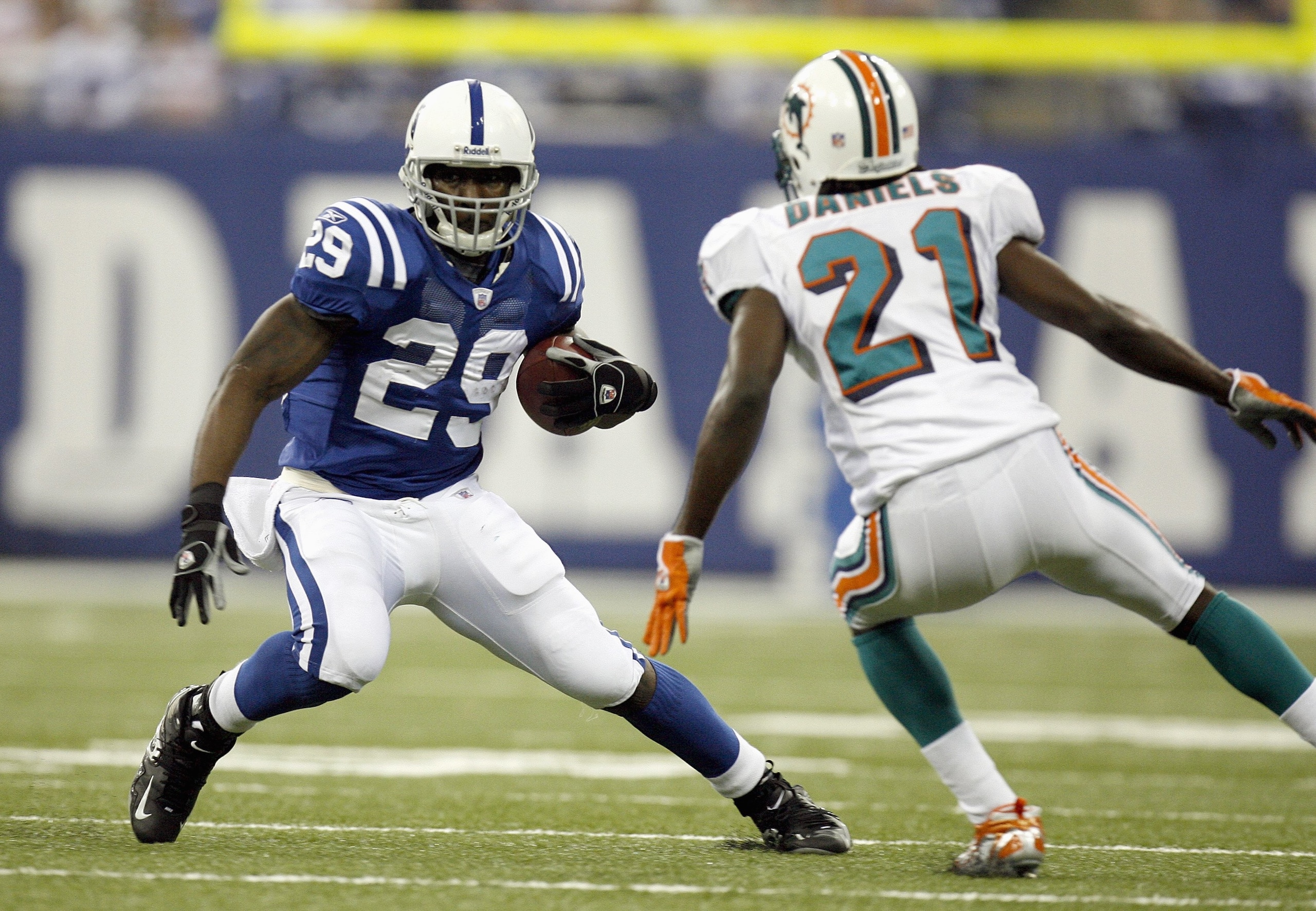 INDIANAPOLIS - DECEMBER 31: Joseph Addai #29 of the Indianapolis Colts carries the ball against Travis Daniels #21 of the Miami Dolphins at the RCA Dome on December 31, 2006 in Indianapolis, Indiana. Indianapolis won the game 27-22. (Photo by Gregory Sham INDIANAPOLIS - DECEMBER 31: Joseph Addai #29 of the Indianapolis Colts carries the ball against Travis Daniels #21 of the Miami Dolphins at the RCA Dome on December 31, 2006 in Indianapolis, Indiana. Indianapolis won the game 27-22. (Photo by Gregory Sham