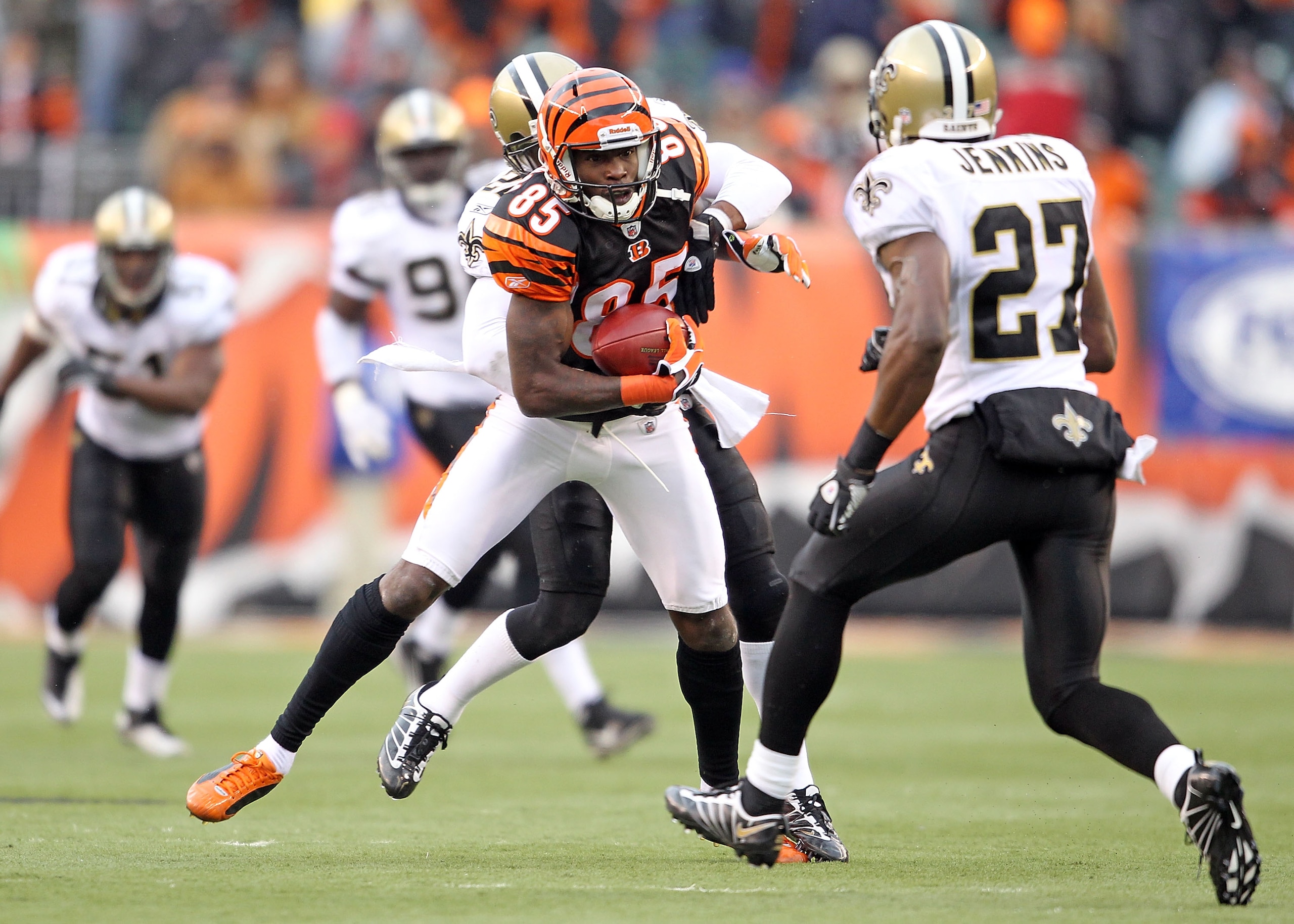 CINCINNATI, OH - DECEMBER 05:  Chad Ochocinco #85 of the Cincinnati Bengals is tackled by Tracy Porter#22 of the New Orleans Saints during the NFL game at Paul Brown Stadium on December 5, 2010 in Cincinnati, Ohio.  The Saints won 34-30.  (Photo by Andy L