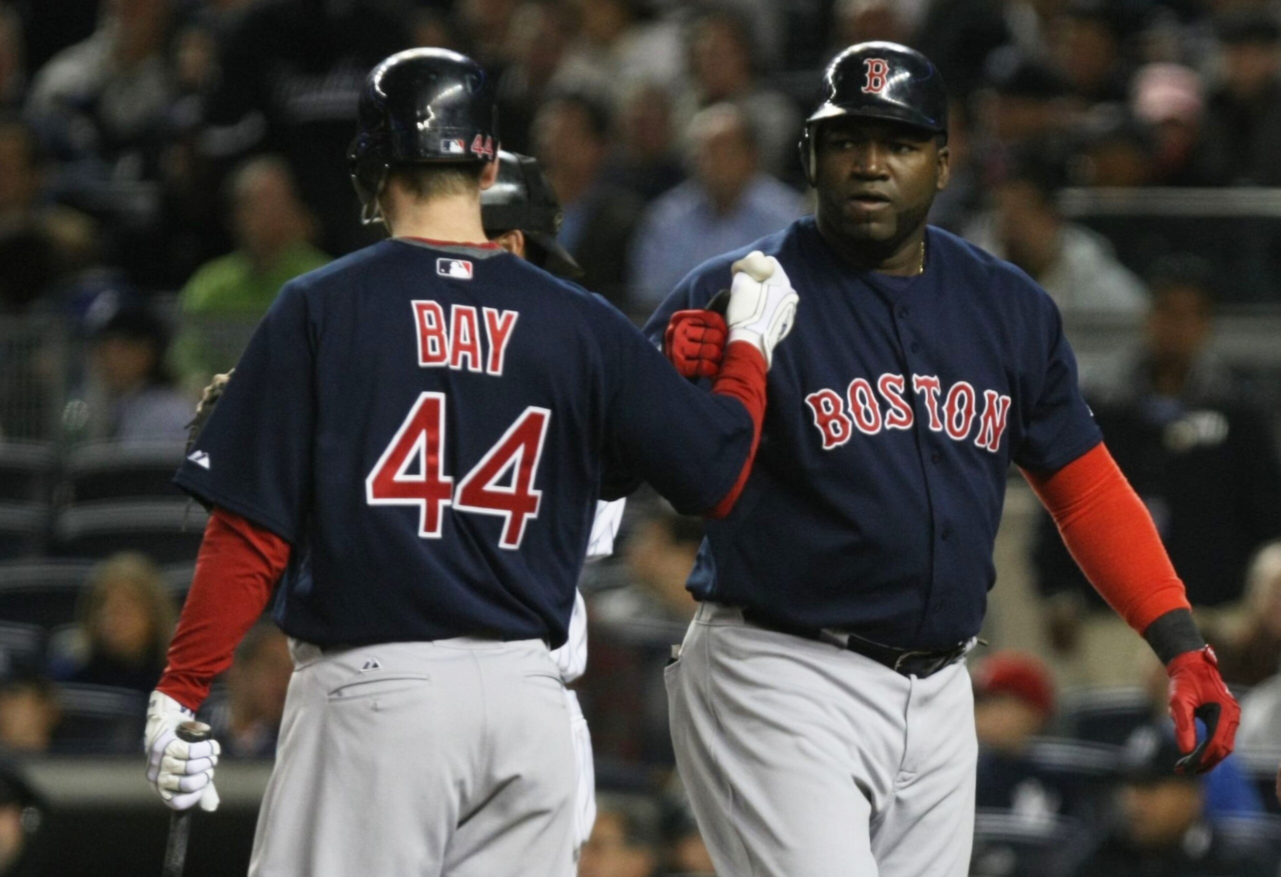 NEW YORK - SEPTEMBER 25:  Designated hitter David Ortiz #34 of the Boston Red Sox celebrates with teammate Jason Bay #44 after hitting a homerun in the sixth inning of the game against the New York Yankees at Yankee Stadium on September 25, 2009 in the Br