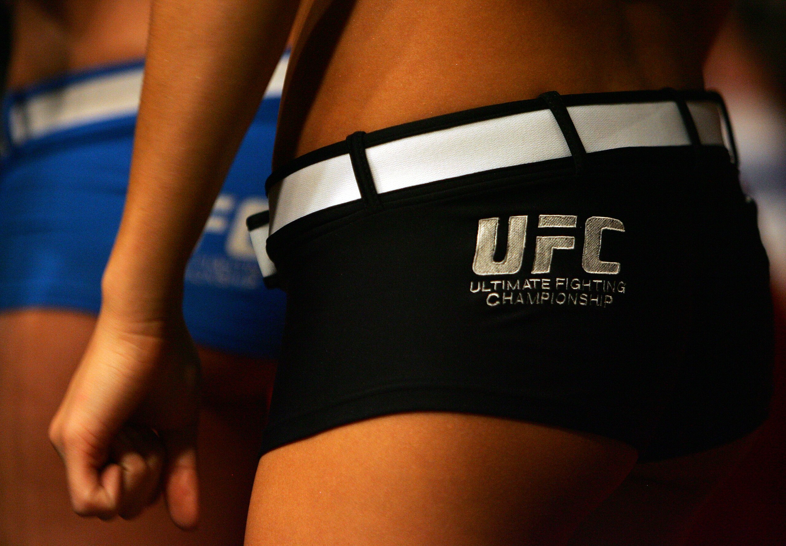 MANCHESTER, UNITED KINGDOM - APRIL 21: The card girls wait to enter the octagon during the Ultimate Fighting Championship at the Manchester Evening News Arena on April 21, 2007 in Manchester, England. (Photo by Gary M. Prior/Getty Images).