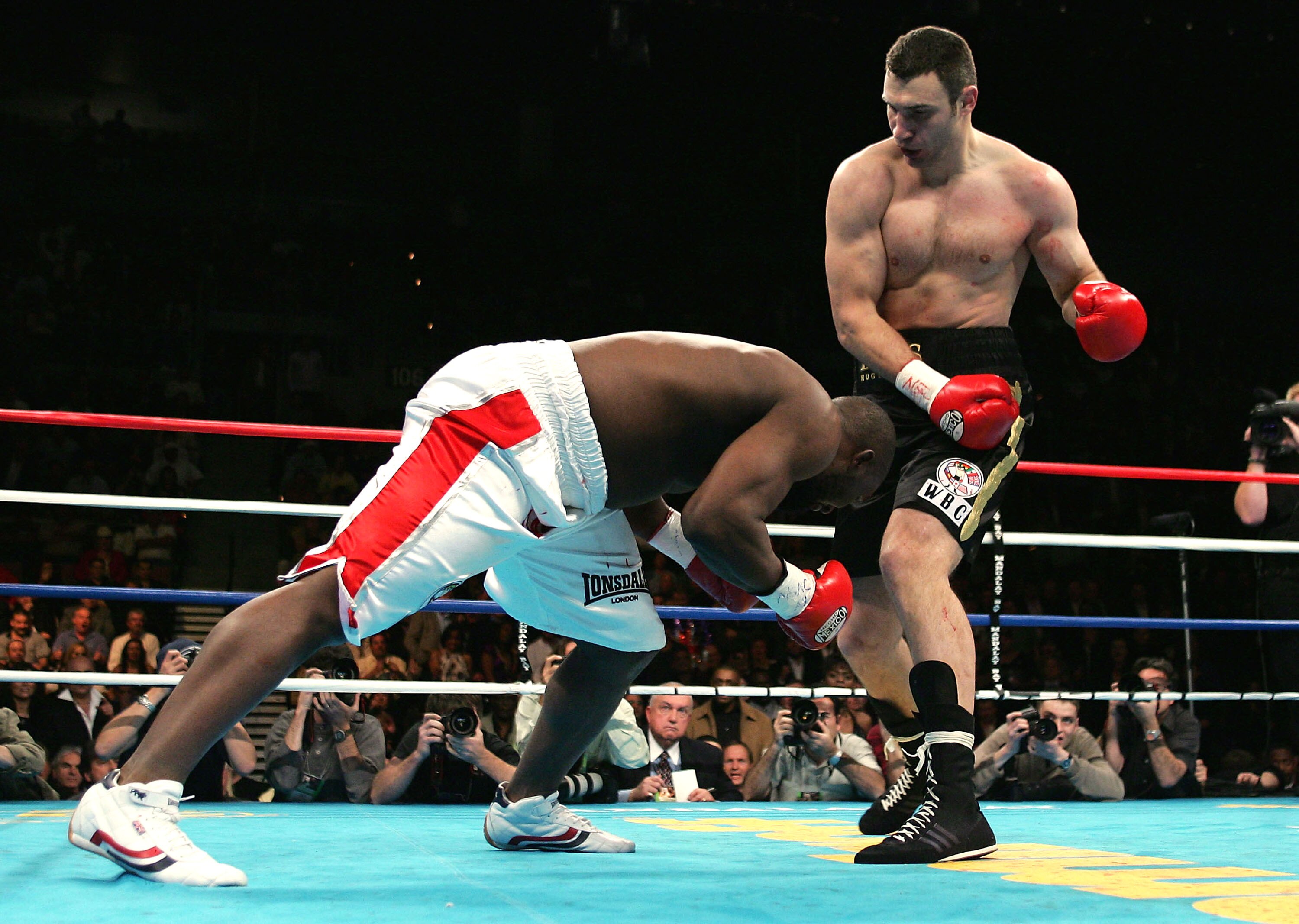 LAS VEGAS, NV - DECEMBER 11: Vitali Klitschko of Ukraine knocks down Danny Williams of England in the first round on his way to winning by TKO at 1:26 of the Eight round and retain his WBC Heavyweight Title on December 11, 2004 at The Mandalay Bay in Las