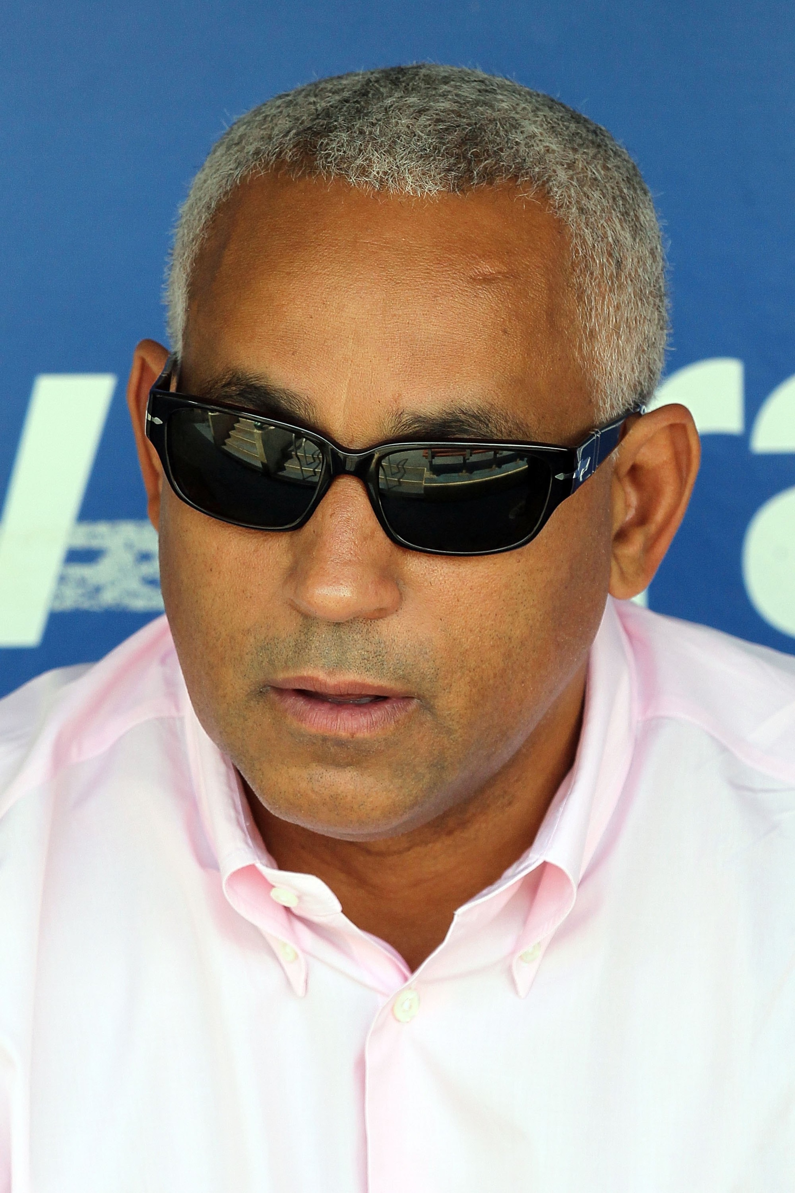 PHILADELPHIA - MAY 01:  General manager Omar Minaya of the New York Mets looks on as his team takes batting practice before playing the Philadelphia Phillies at Citizens Bank Park on May 1, 2010 in Philadelphia, Pennsylvania.  (Photo by Jim McIsaac/Getty