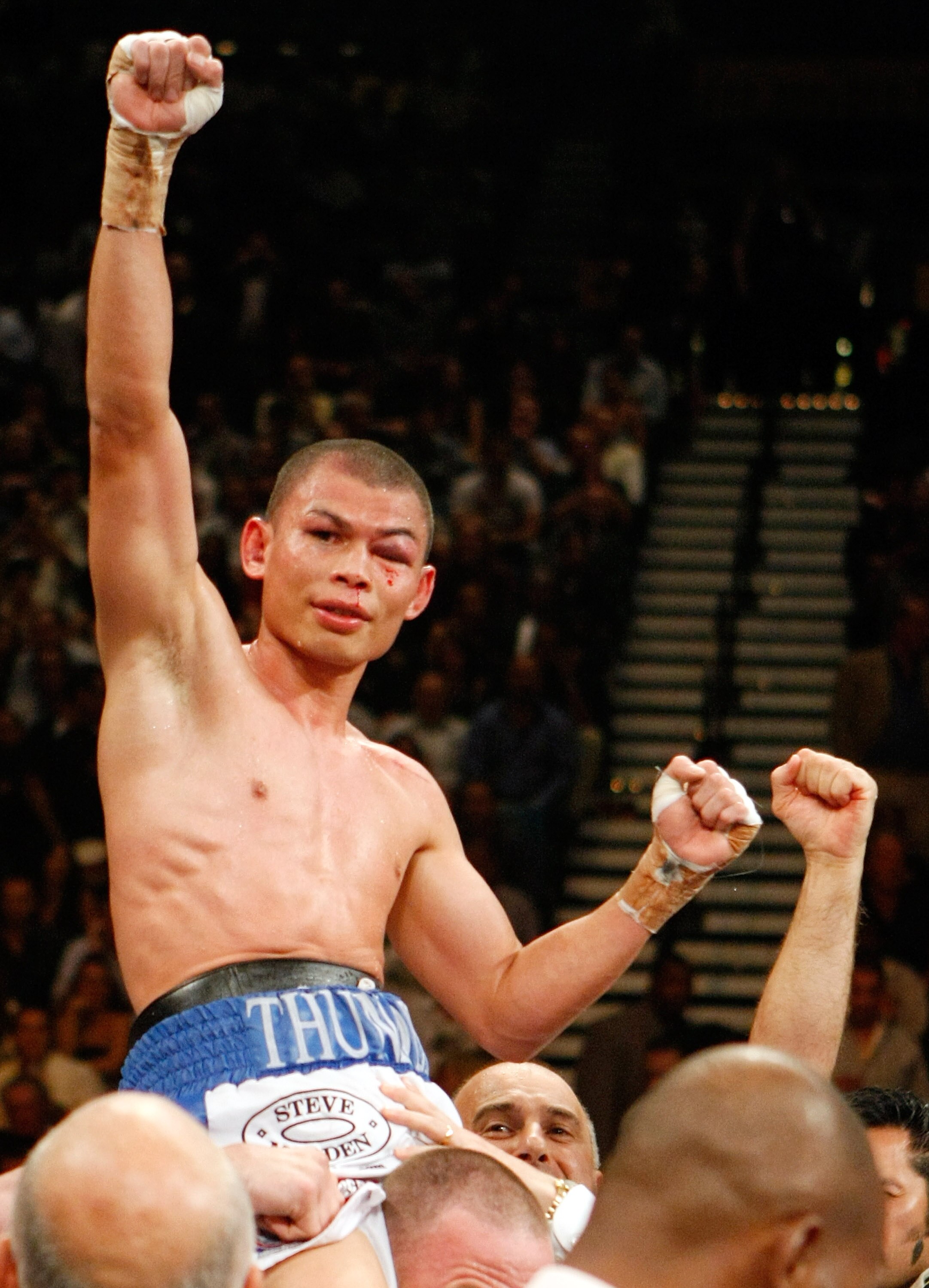 LAS VEGAS - SEPTEMBER 19:  Chris John celebrates his victory over Rocky Juarez to retain his WBA featherweight title at the MGM Grand Garden Arena September 19, 2009 in Las Vegas, Nevada.  (Photo by Ethan Miller/Getty Images)