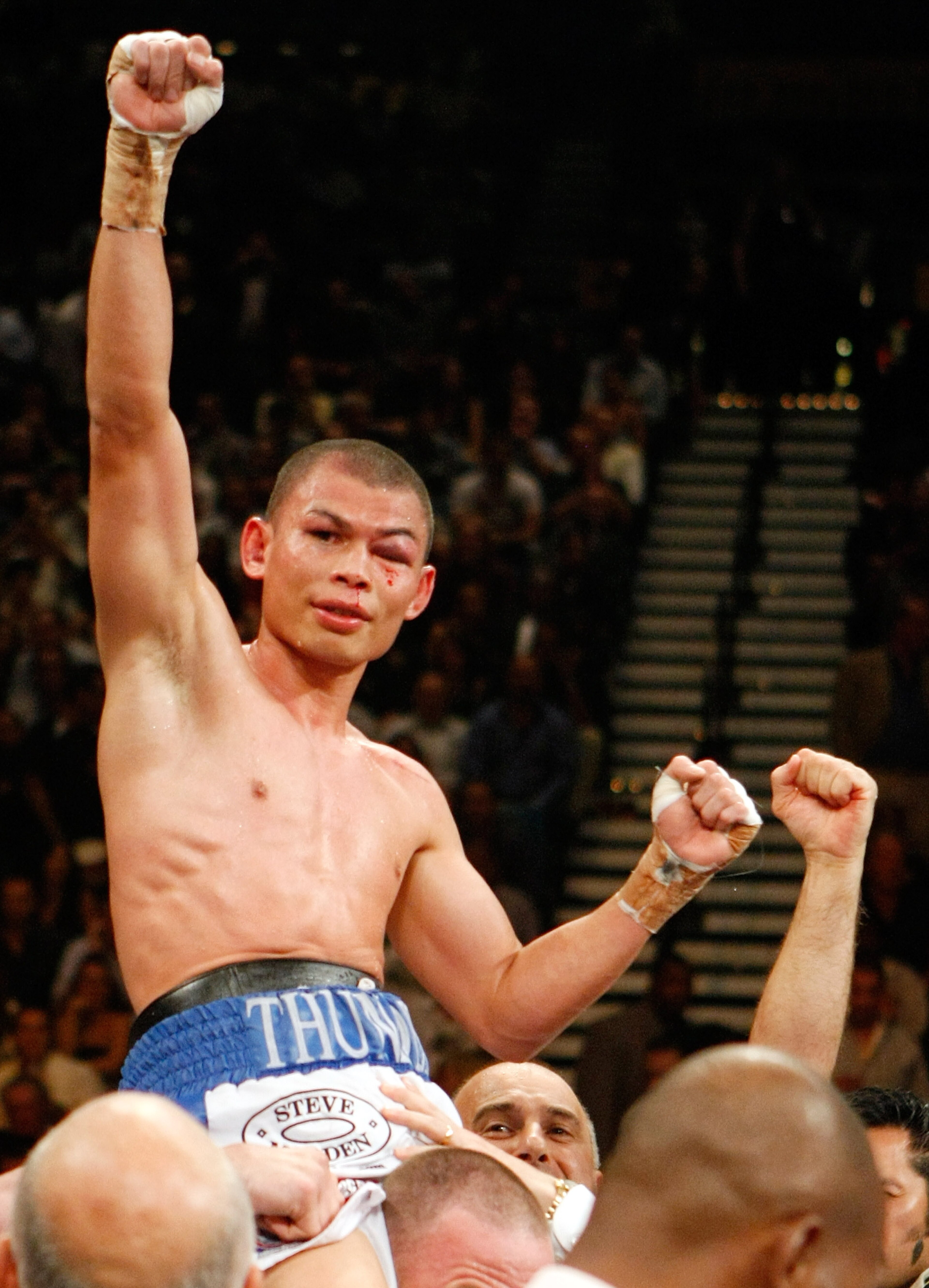 LAS VEGAS - SEPTEMBER 19:  Chris John celebrates his victory over Rocky Juarez to retain his WBA featherweight title at the MGM Grand Garden Arena September 19, 2009 in Las Vegas, Nevada.  (Photo by Ethan Miller/Getty Images)