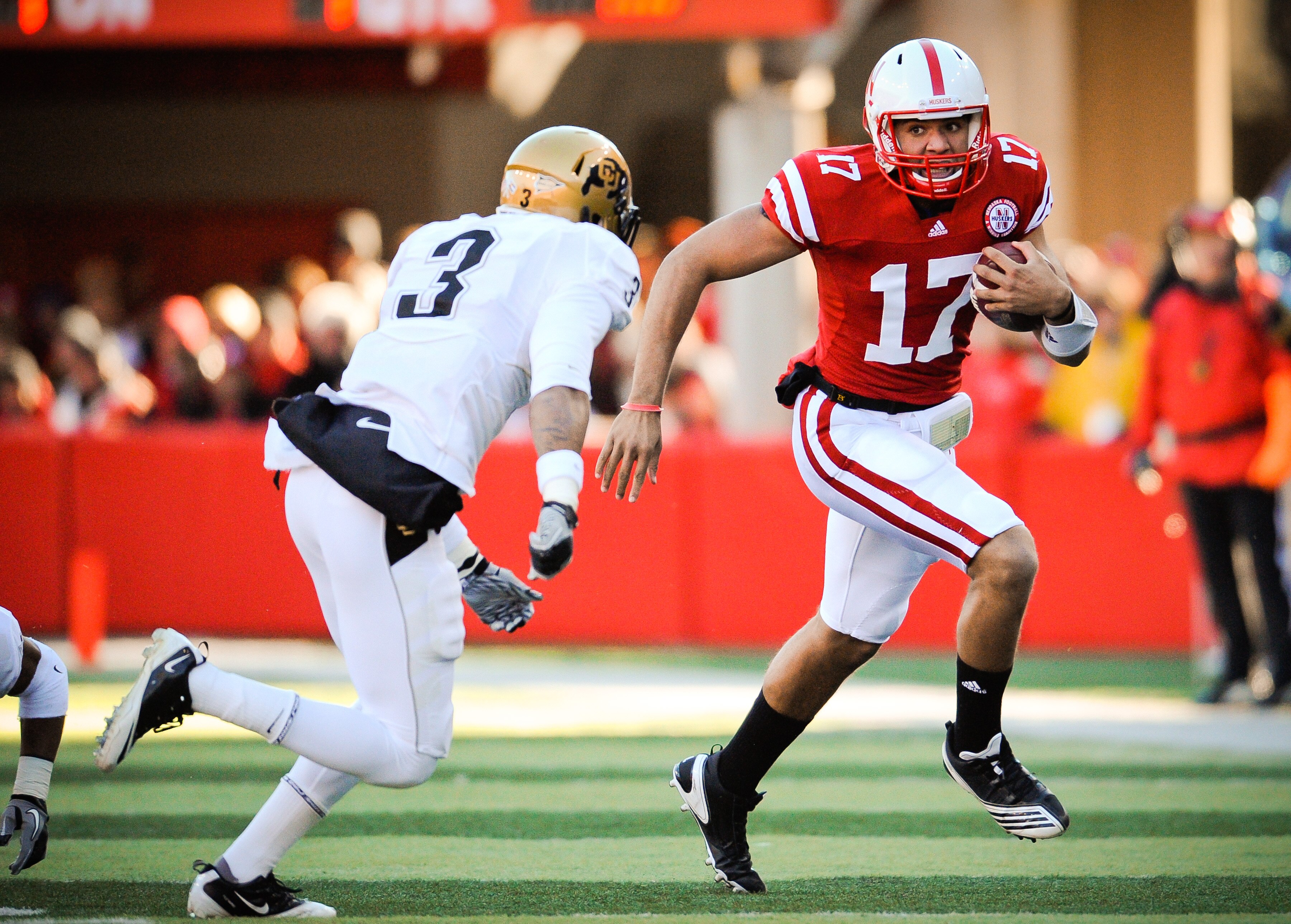LINCOLN, NE - NOVEMBER 26: Cody Green #17 of the Nebraska Cornhuskers slips past Jimmy Smith #3 of the Colorado Buffaloes during their game at Memorial Stadium on November 26, 2010 in Lincoln, Nebraska. Nebraska defeated Colorado 45-17 (Photo by Eric Fran